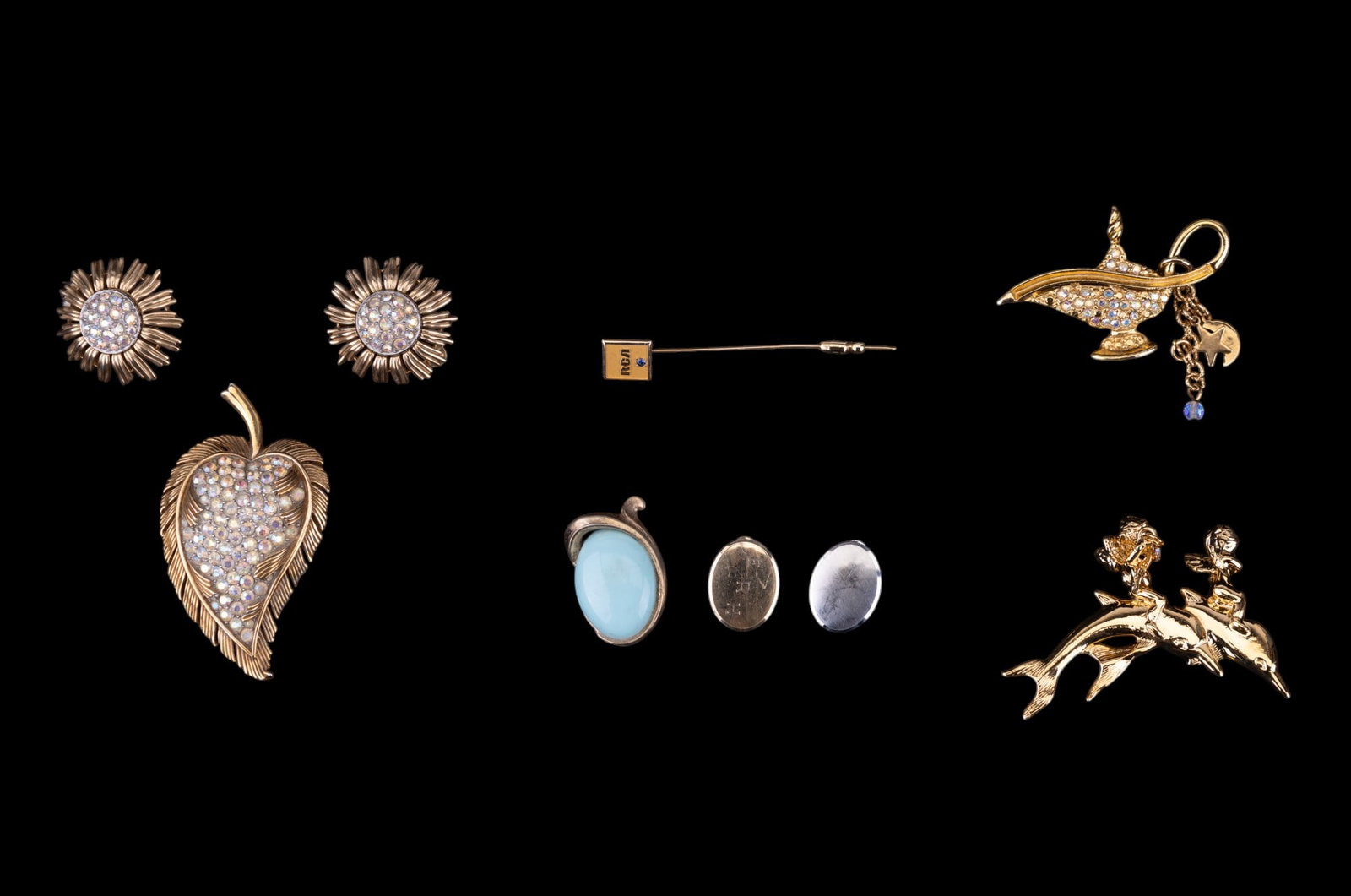 Kirks Folly Lamp & Dolphins w/ Cherubs Brooches: Kirks Folly Aladdin Genie Lamp gold tone brooch w/ Aurora Borealis rhinestones & dangling star & crescent man in the moon charms, Kirks Folly Cherubs Riding Dolphins gold tone brooch w/ one cherub hol
