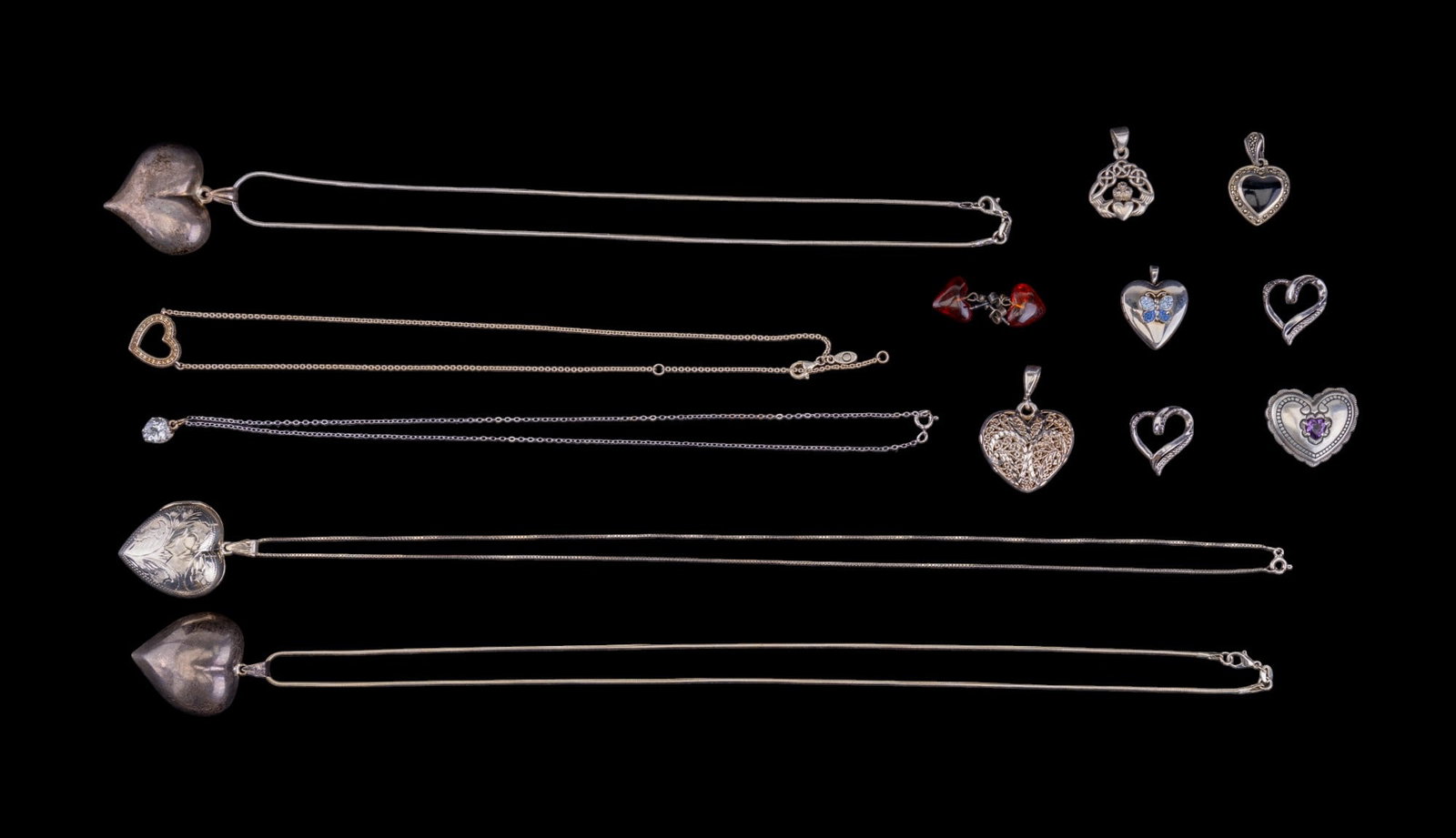 Sterling Silver Pandora & Other Heart Necklaces: Collection of sterling silver heart necklaces & pendants, including a locket pendant necklace, 2 similar hollow heart pendant necklaces, a Morning sun necklace w/ a flower inside of the heart, & a Pan