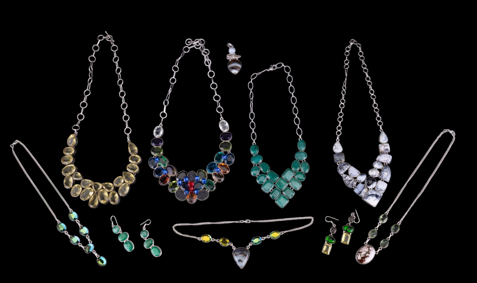 Agate, Hardstone, & Rhinestone Silverplate Jewelry: Grouping of silverplate jewelry, including a green hardstone statement necklace w/ complementary dangle earrings, a multi-color rhinestone statement necklace, a dull yellow rhinestone statement neckla