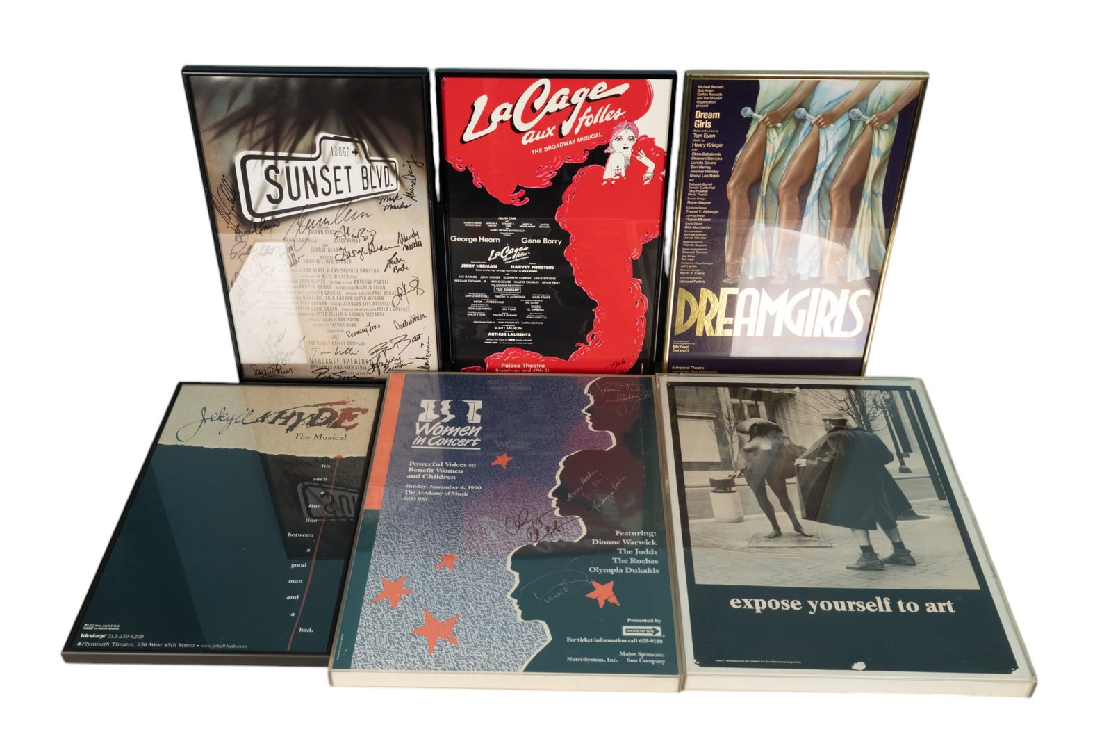 Broadway, Concert, and Novelty Posters (6): Four framed Broadway production posters (14" x 22") "Sunset Blvd." (signed by cast), "Dreamgirls ", "Jeckyl & Hyde", "Le Cage Aux Folles" in black metal frames. Also includes 2 lucite framed 18" x 24"