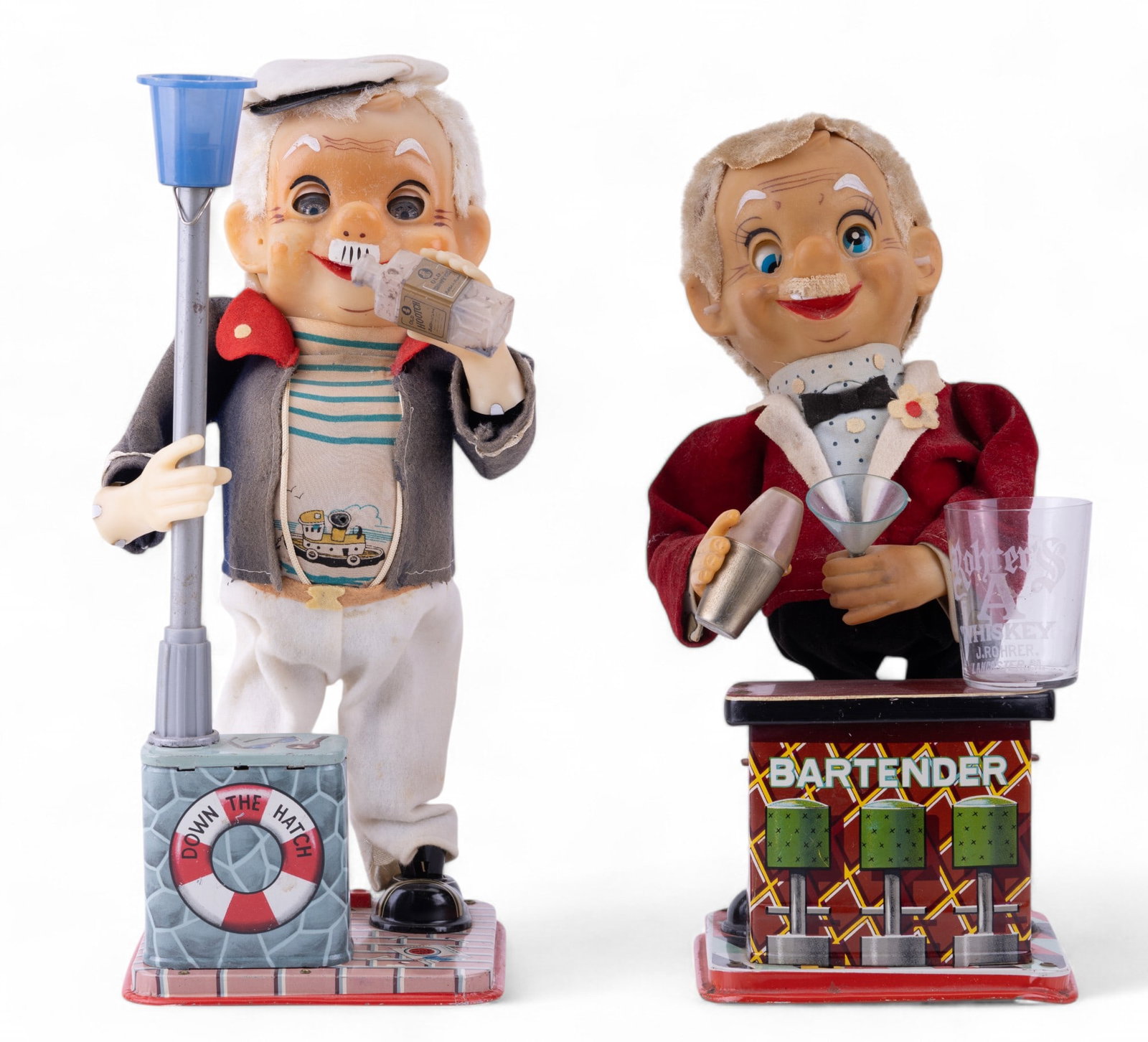 Rosko Bartender and The Drinking Captain Tin Toys: Vintage Rohrer's Whiskey Lancaster, PA etched shot glass, Rosko the Bartender battery operated bartender's helper painted tin, battery operated toy, one wire on bottom requires repair, right eye is lo