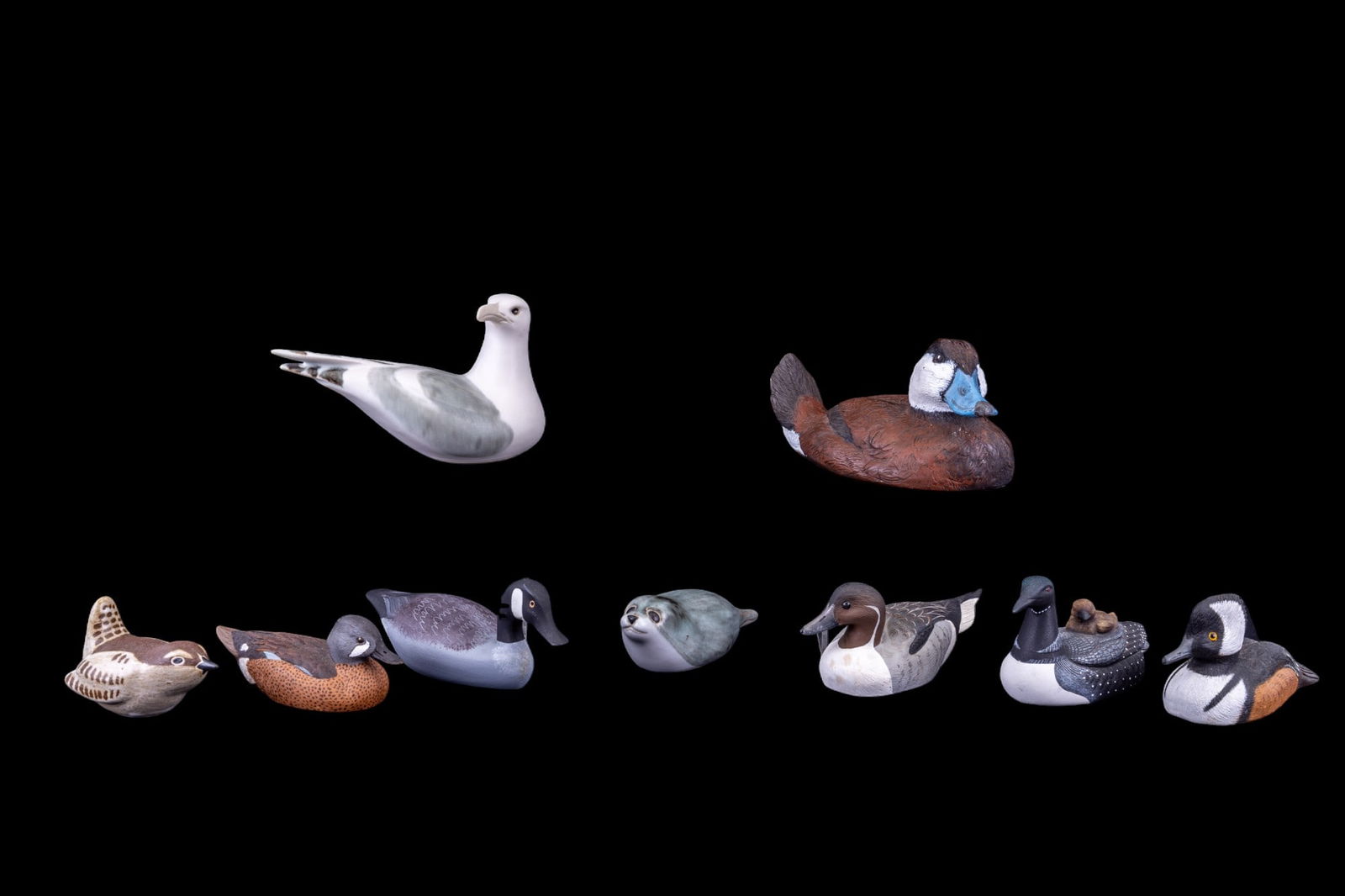 Hand Painted Water Fowl Figurines: An assortment of small water fowl figurines, wren, and seal featuring artists such as a hand carved wood and painted Canadian Goose by Art Boxleitner (1936-2017) American, based out of Willow Street,