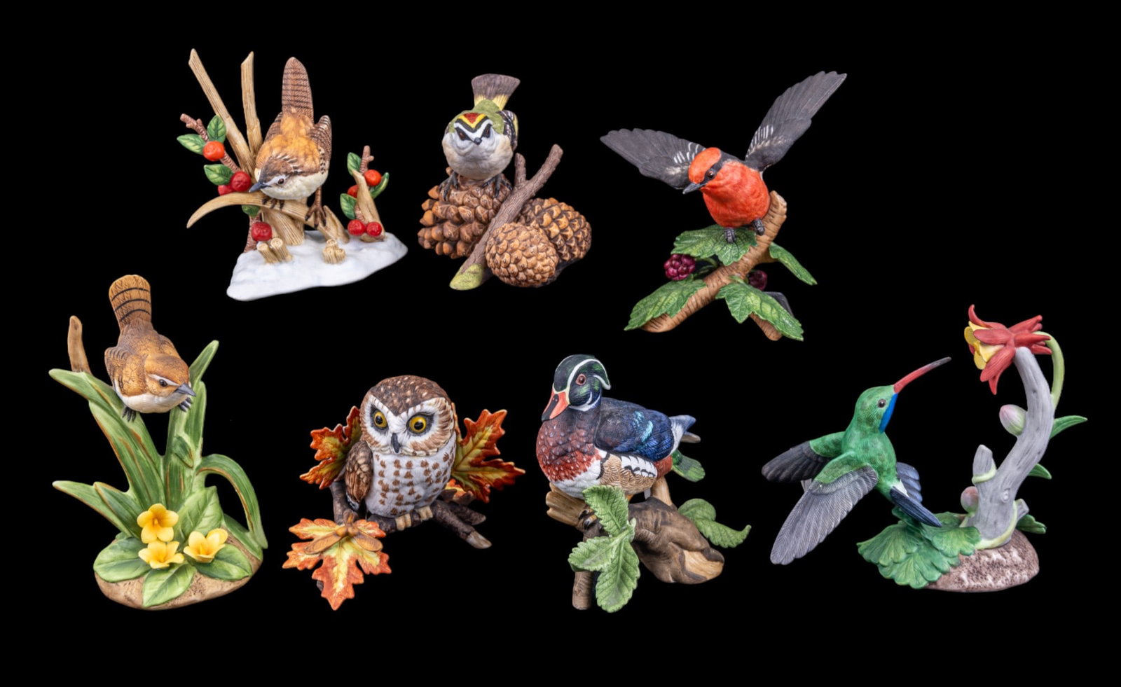 Lenox Porcelain Bird Figurines: A collection of six Lenox porcelain bird figurines featuring the Golden Crown Kinglet, Saw-Whet Owl, Wood Duck, Vermillion Flycatcher, Broad-Billed Hummingbird, Marsh Wren, and a Carolina Wren by Andr