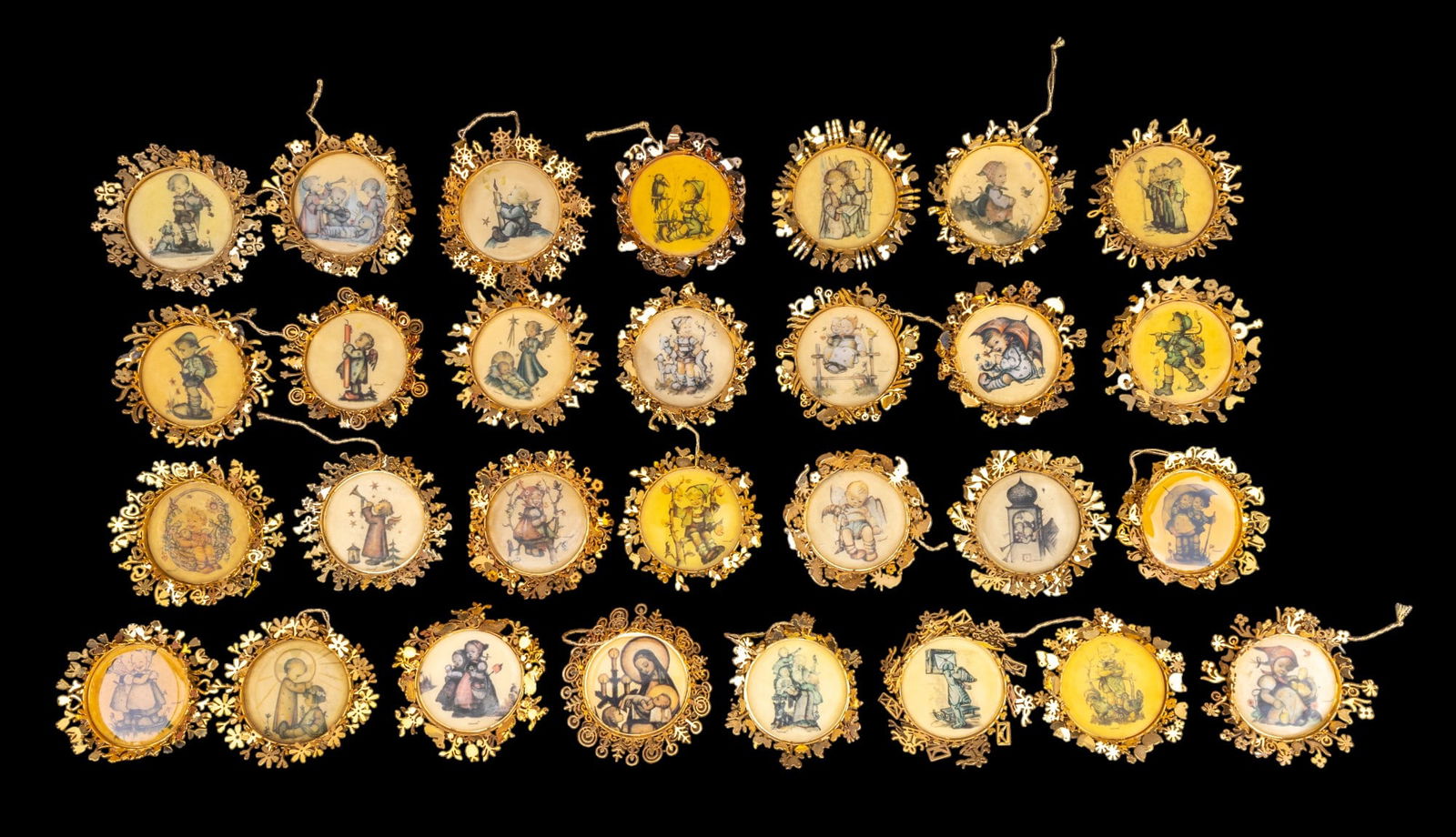 Hummel Christmas Ornaments w/OB (29): A collection of 29 Hummel Gold Christmas ornaments featuring 'Spring Basket', 'The Opinion Inspector', 'Looks Like Rain', and many more, see photos for box labels. Included are four empty ornament box