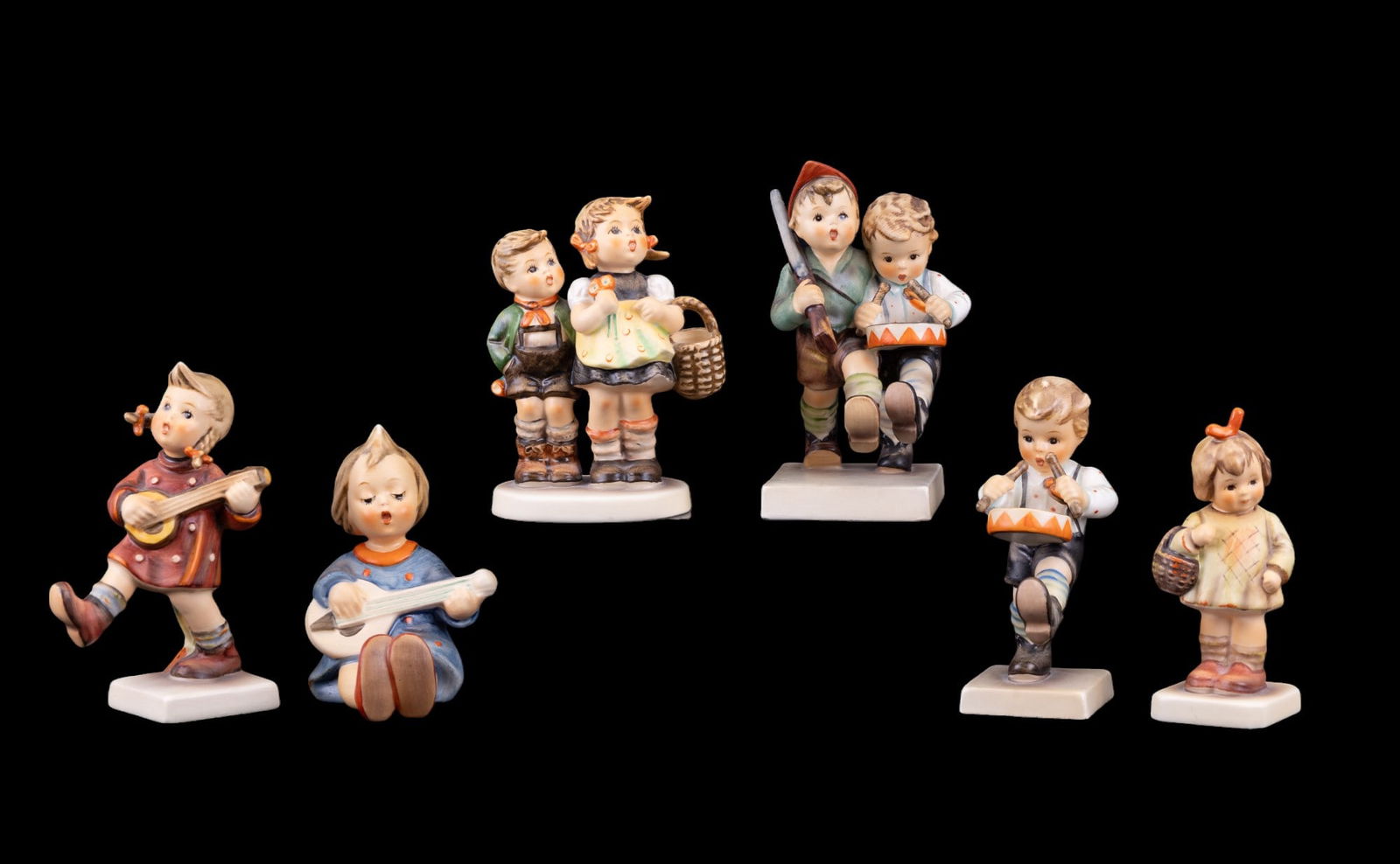 M. I. Hummel Figurines: Happiness #86 5", To Market #49 3/0 4", I Brought You A Gift #479 4", Joyful #53 3", Little Drummer #240 4", and Volunteers #50 2/0 5". No chips or cracks.