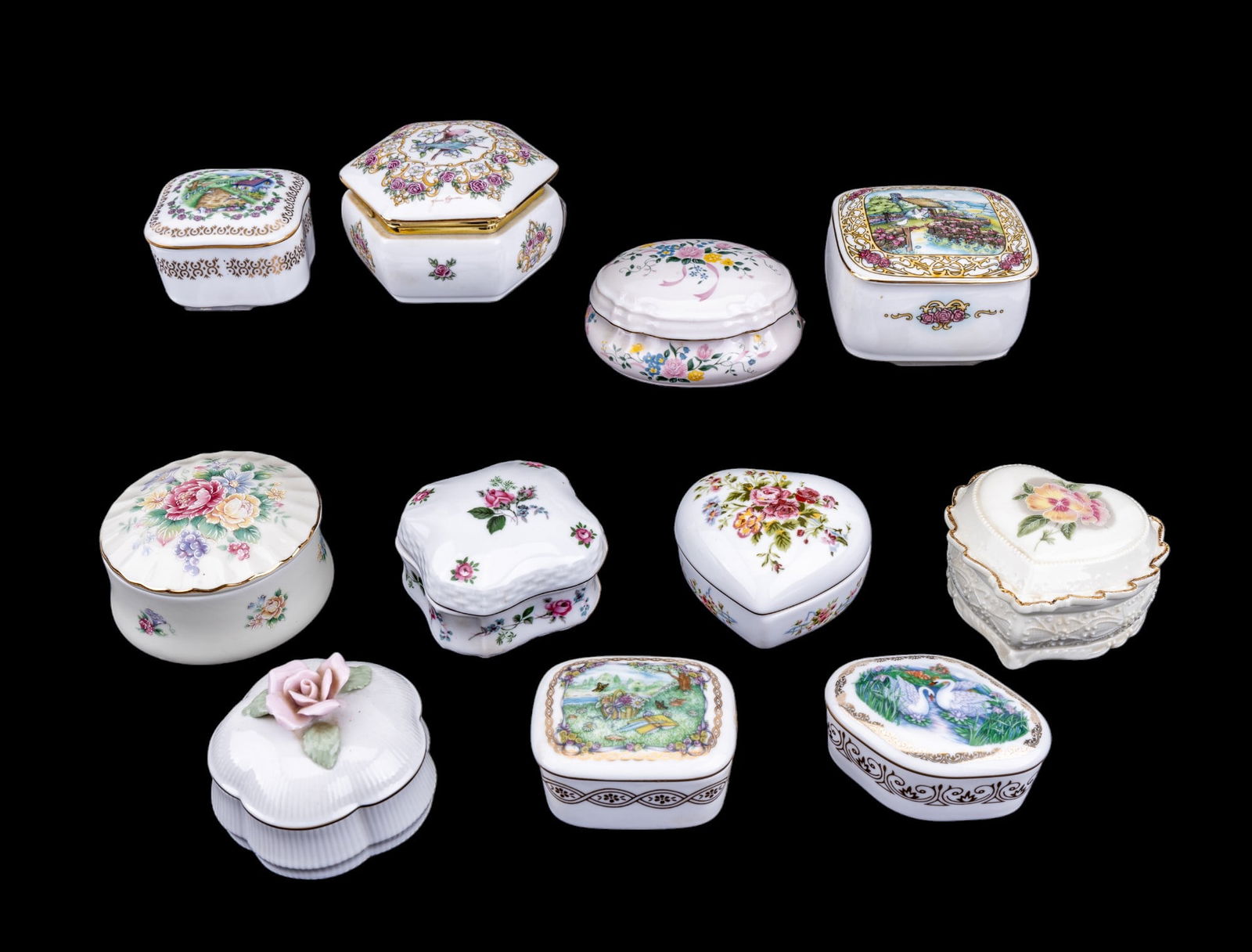 Heritage House Porcelain Music Boxes: An assortment of 11 vintage porcelain Heritage House transfer painted music boxes.