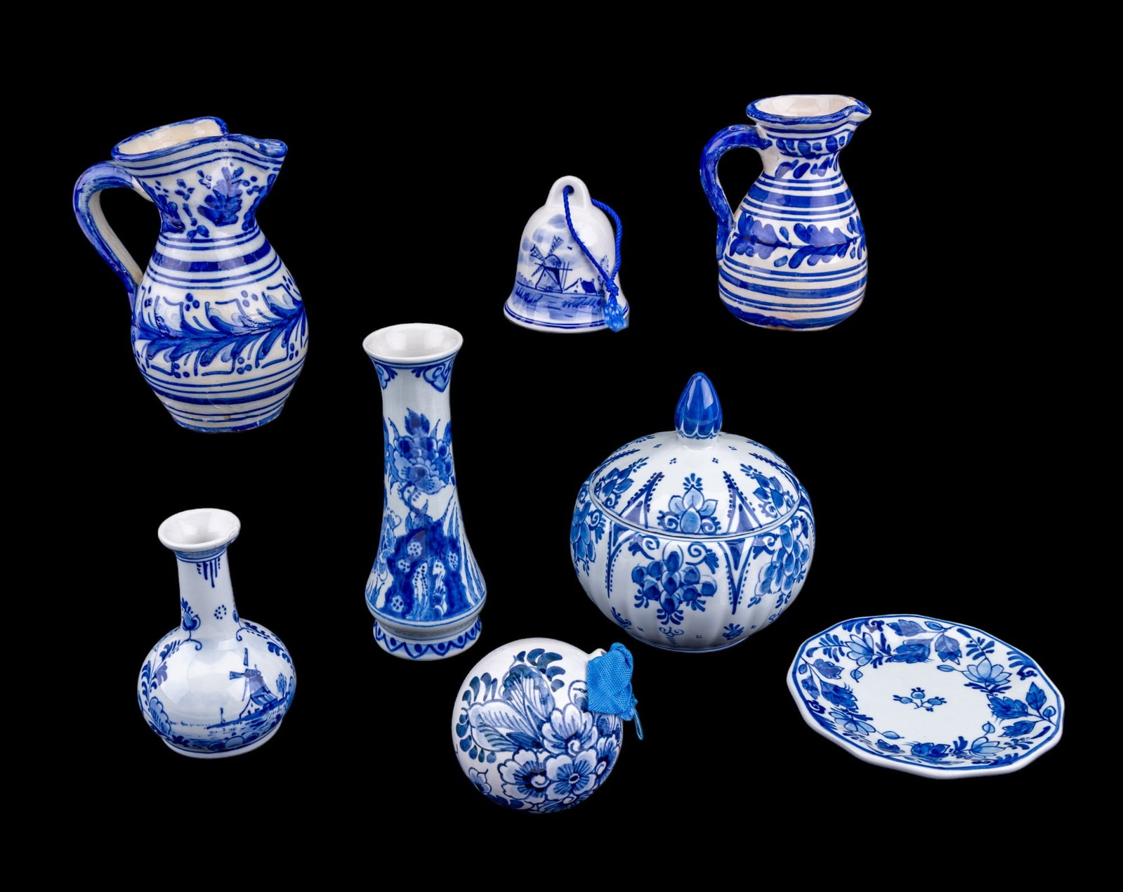 Delft and Toledo Pottery: Delft Holland hand painted pottery including pieces such as two small bud vases 5.25" and 3.5", note repairs to the rim on the smaller of the two, small decorative plate 4", round lidded trinket box 4