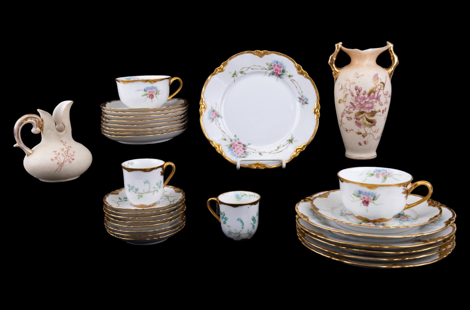 Hutschenreuther Bavarian Tea and Demitasse Set: Floral patterned Hutschenreuther Bavarian china coffee service set with 6 coffee cups, 8 coffee cup saucers, one bread plate, and 6 salad plates, a blue floral Hutschenreuther Demitasse china service 