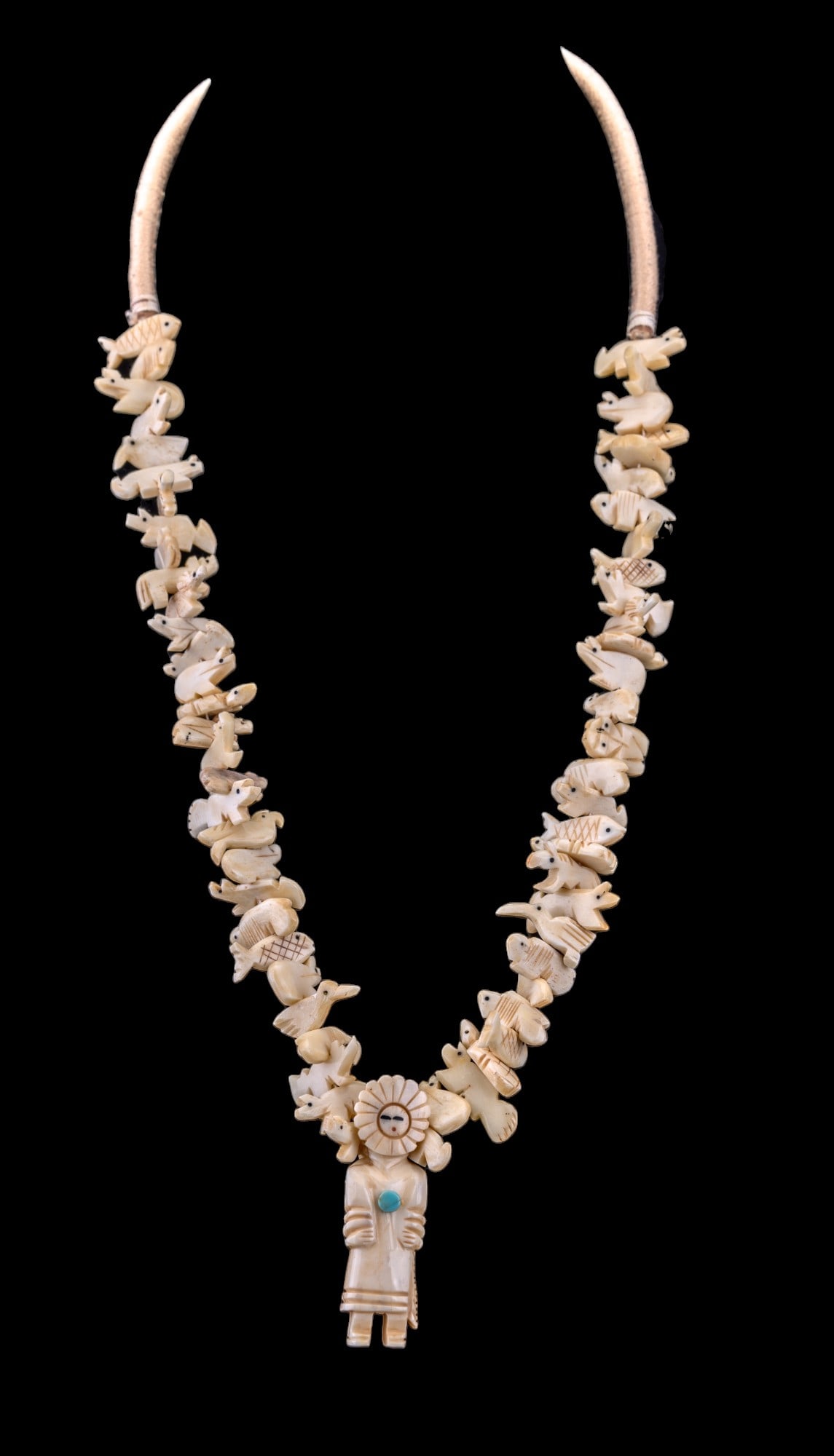 Carved Inuit Vintage Necklace: Long carved Inuit style necklace with various carved animals and central figure.