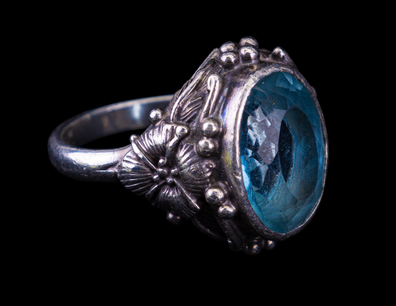 Vintage Estate Ring: Vintage estate sterling silver marked with LS and Arrow, with ornate floral details and topaz style stone.