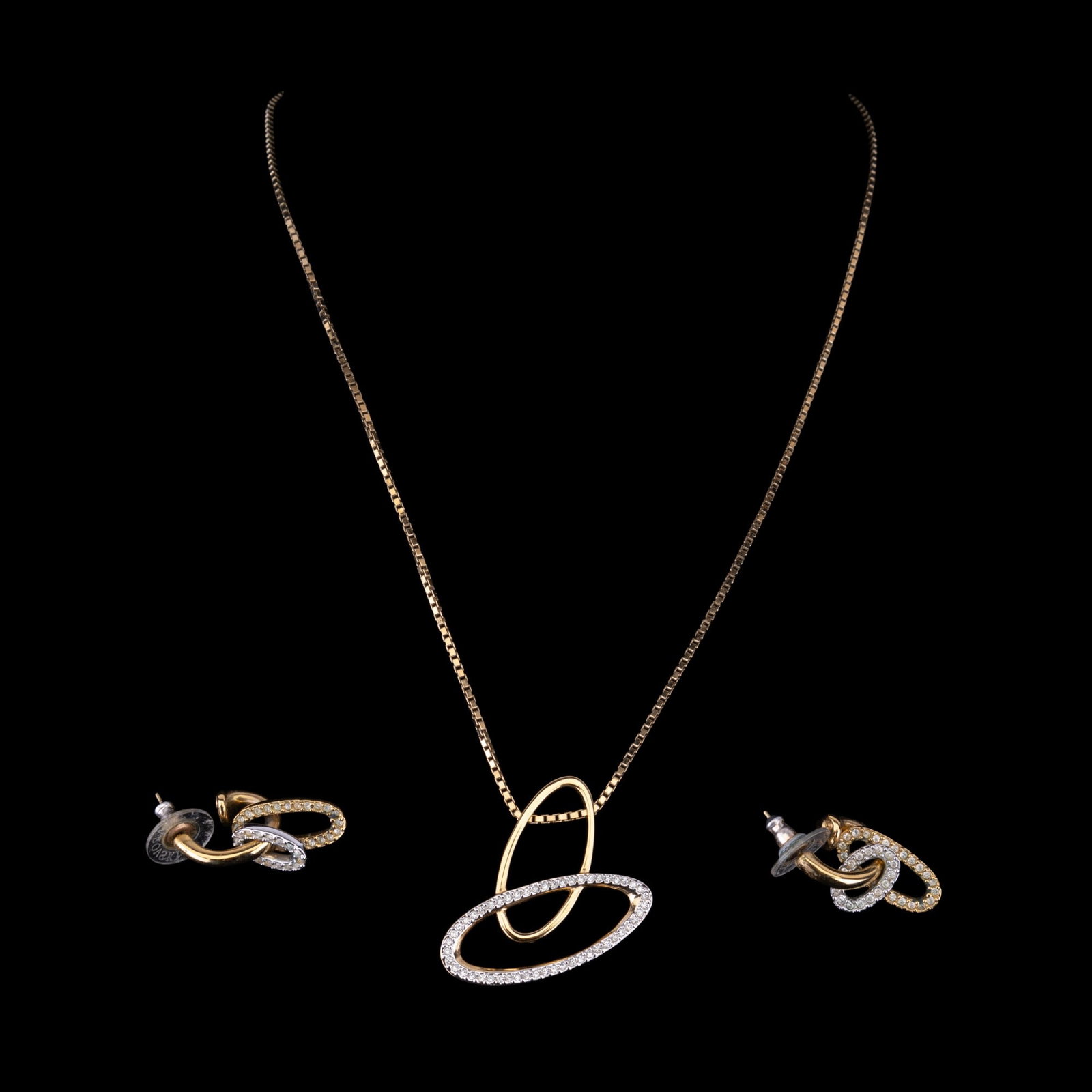 Swarovski Crystal Jewelry: Gold tone and crystal signed Swarovski necklace with matching earrings.