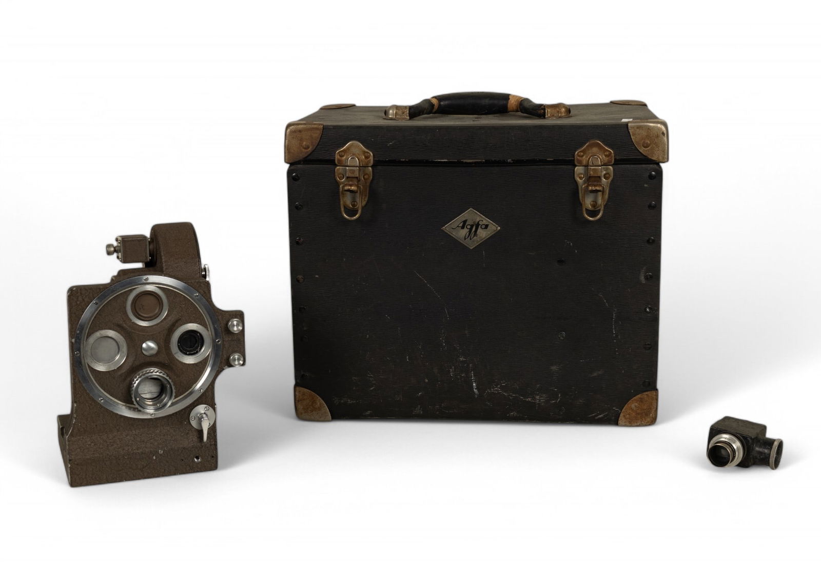 Bell & Howell Film Camera, Agfa Case, Accessories: Bell & Howell Filmo 70-T Model A movie camera with serial number 648910. Includes original Agfa carrying case featuring metal latches and logo plate. Accompanied by Hugo Meyer Correctoscope focusing e