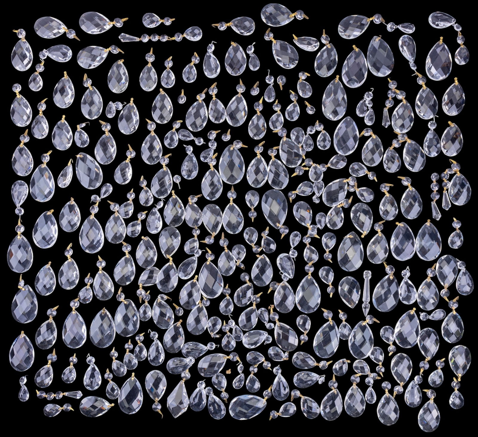 Crystal Chandelier Prism Collection: A collection of estimated to be over 150 crystal chandelier prisms of varying sizes and designs, as shown in the images. Each piece is crafted from clear glass crystal, suitable for use in chandeliers