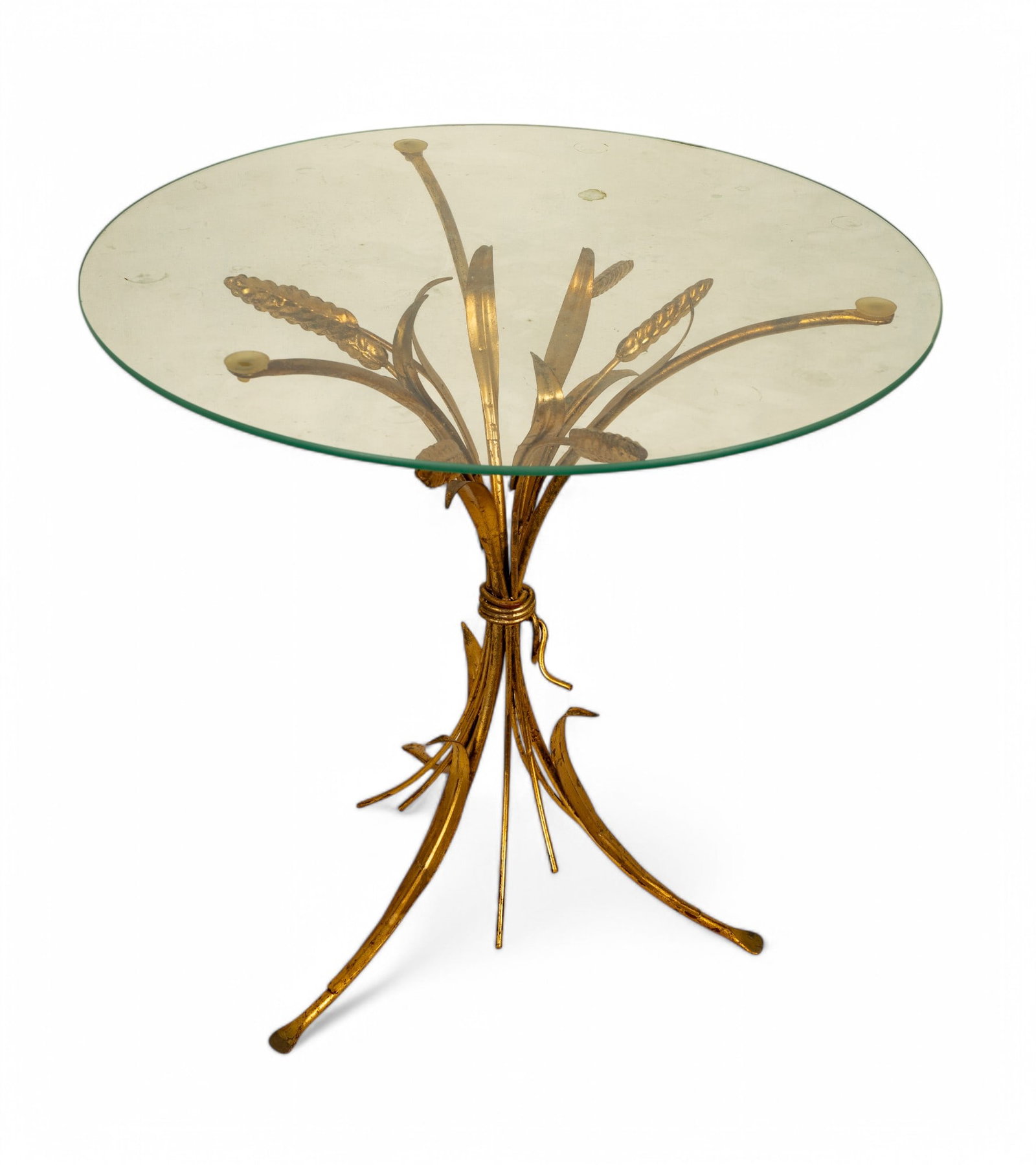 MCM Glass-Top Round Table with Gilded Wheat Base: Round glass-top MCM side table measuring 18x18", featuring a golden gilt metal base styled with wheat motif. The glass top is secured with rubber suction cups. Condition appears consistent with usage 