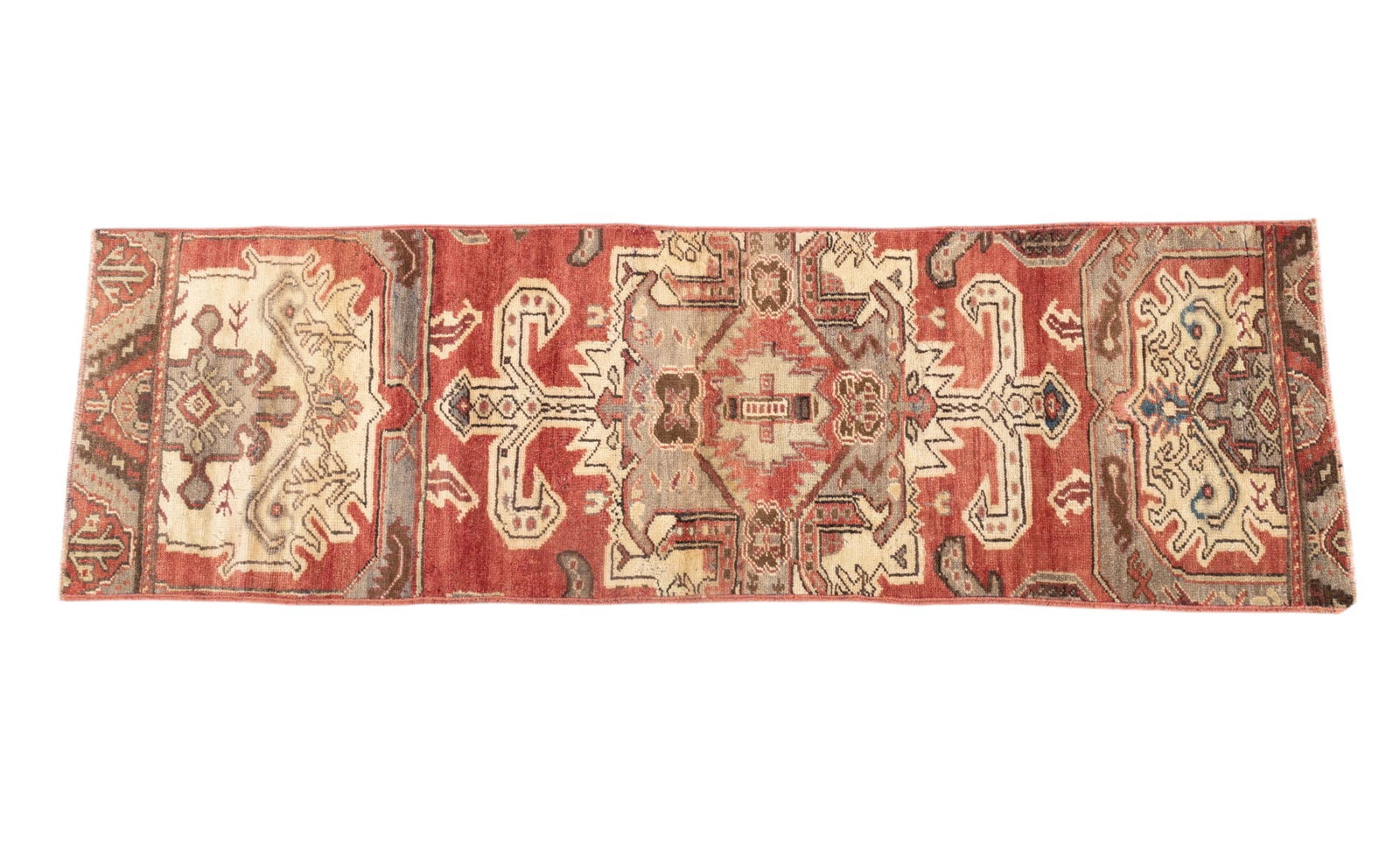 Antique Oushak Rug: Antique Oushak rug approx. 2'2" x 7' w/ red, brown, tan, & ivory patterns w/ geometric motifs. *All rugs / carpets are used & come from fine estates. Keystone Auctions does not clean the rugs, and the