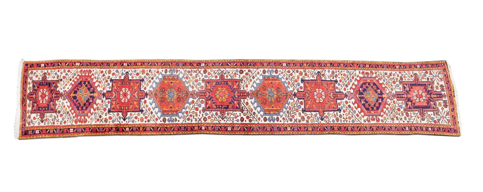 Persian Heriz Rug: Persian Heriz rug approx. 2'8" x 13'7" w/ red, navy blue, livid blue-gray, burnt orange, brown, tan, & ivory patterns w/ geometric & floral motifs. *All rugs / carpets are used & come from fine estate