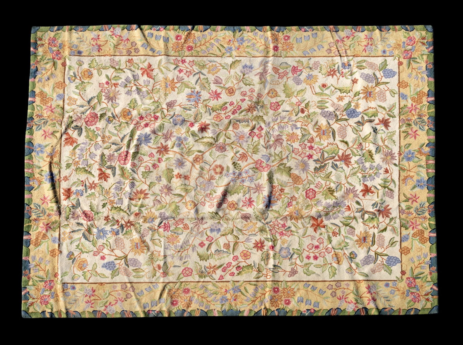 Hand-Tufted Wool Floral Hook Rug: Hand-tufted vintage hook rug approx. 7'10" x 10'3" w/ gold, green, blue, livid bluish-gray, lavender, magenta, clay red, brown / tan, & ivory patterns w/ floral motifs. *All rugs / carpets are used &