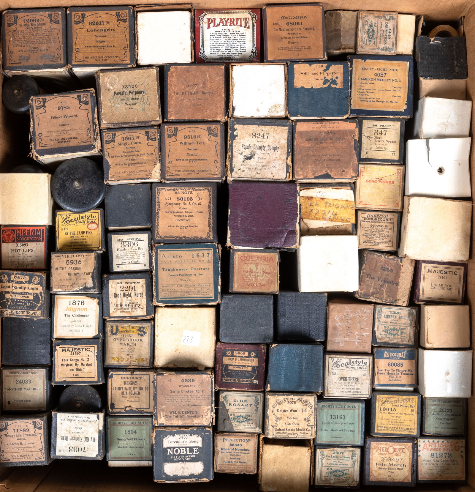 Vintage Player Piano Rolls (70+): Collection of over 70 total vintage player piano scrolls. Most rolls are in their original boxes. Makers include Vocalstyle, Autokrat, Melodie, The Aeolian Company, & more. See photos for further deta