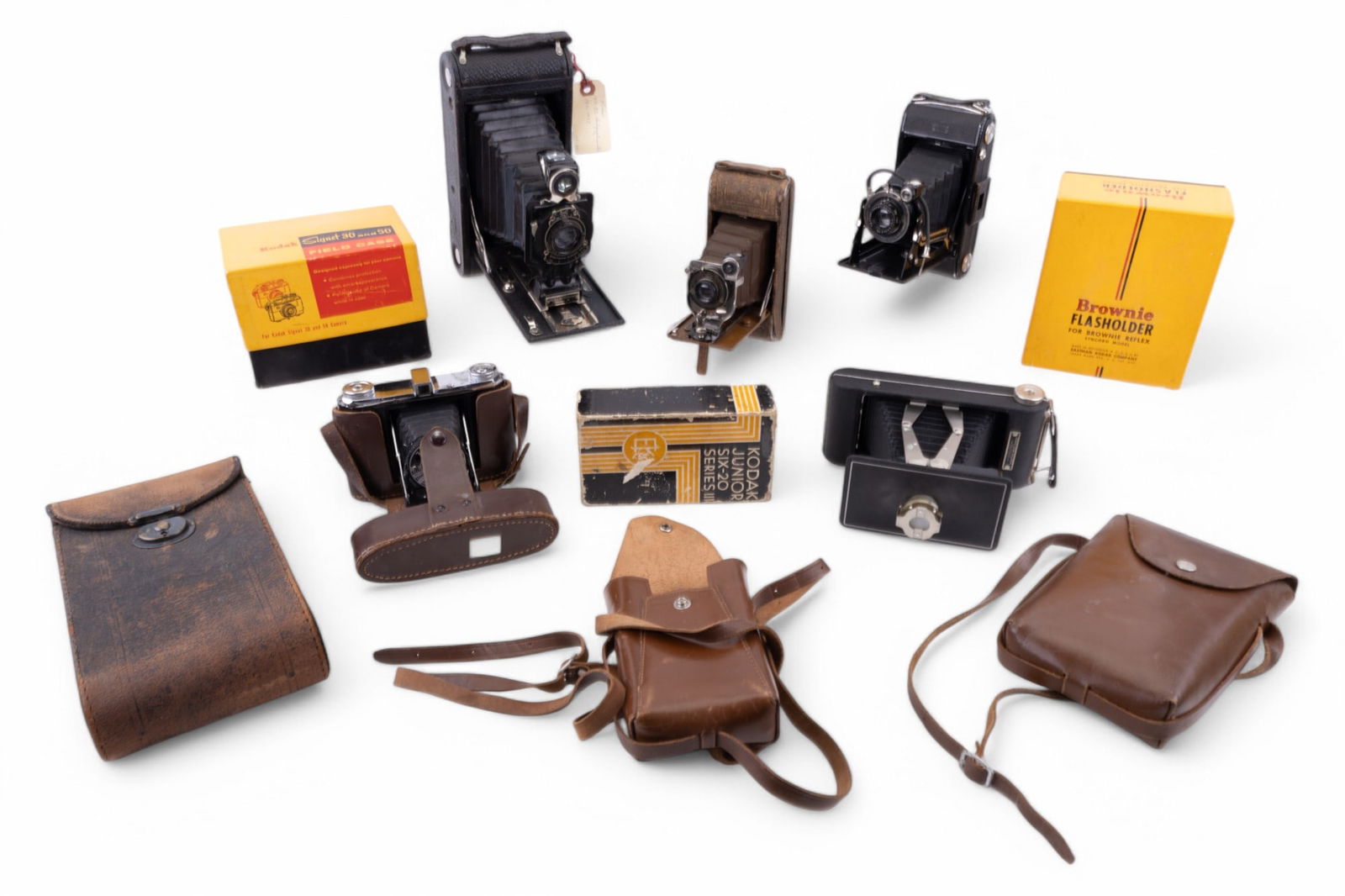 Early Kodak Folding Cameras w/ Cases (4) + More: Collection of 5 antique / early vintage folding cameras w/ leather cases, including No. 2C Autographic Kodak Jr., Kodak 16MM Enlarger, Zeiss Ikon folding camera (no case), an Ansco Readyset folding ca