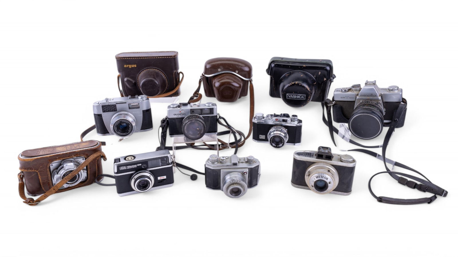 Vintage Argus, Zeiss Ikon, & More Cameras + Cases: Collection of 11 vintage cameras, most w/ leather cases. Models include Zeiss Ikon Voigtlander Vitessa 126 Electronic, Leidolf Wetzlar Unimatic 606, Argus C3, Welmy-35, Meteor, Halina 35X, Minolta SRT