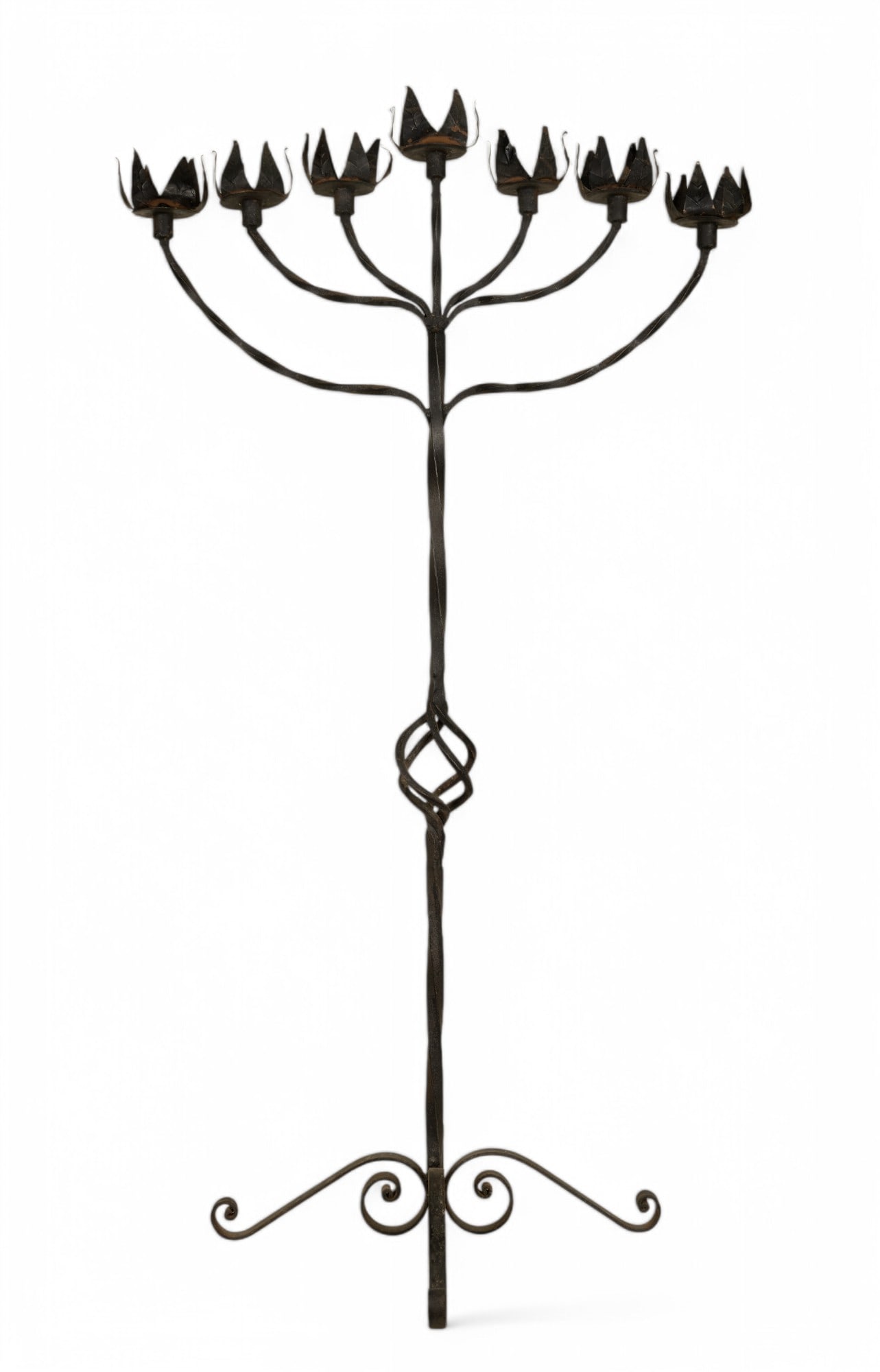 Wrought Iron Vintage Candelabra: Vintage twisted wrought iron floor standing candelabra, with seven leaf motif slots for taper candles, highest in the center, note rust and wear due to use and age. Feet width measures 20x20" and tota