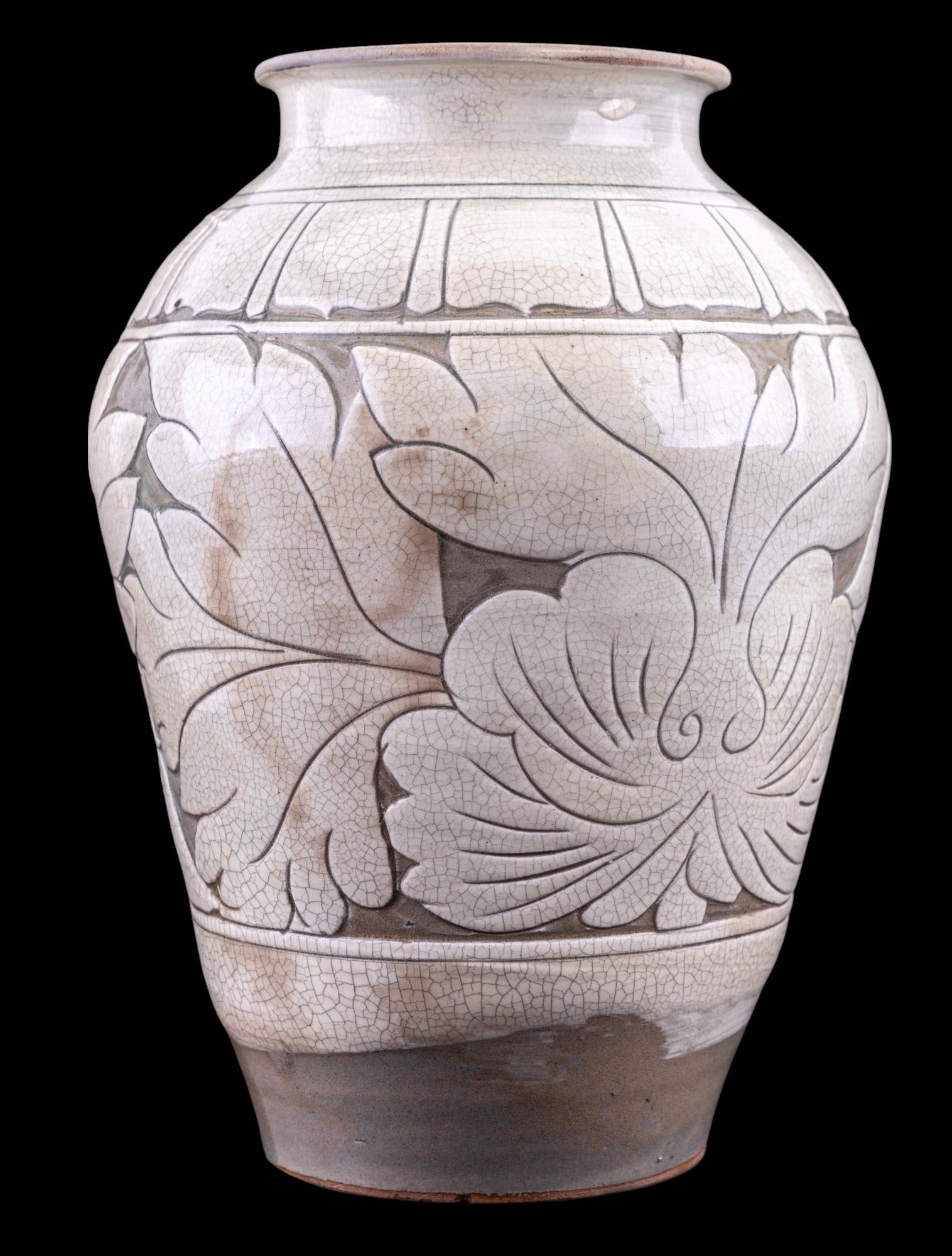 Korean Buncheong Carved Floral Vase: Korean Buncheong carved vase with floral motif in white and grey glaze measuring approx. 11.5" H x 8.25 Dia. w 4.5" Dia. mouth.
