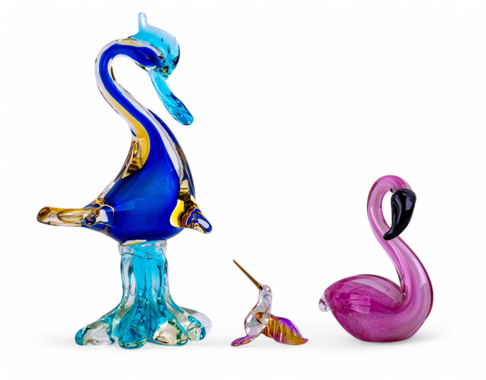 Murano and Russ Blown Glass Bird Figurines: Small pink and 14k gold blown glass hummingbird ornament by Russ Berrie and Co, 4", Murano blown glass pink flamingo sitting figurine 6", and a Murano blue, gold, and turquoise colored blown glass duc