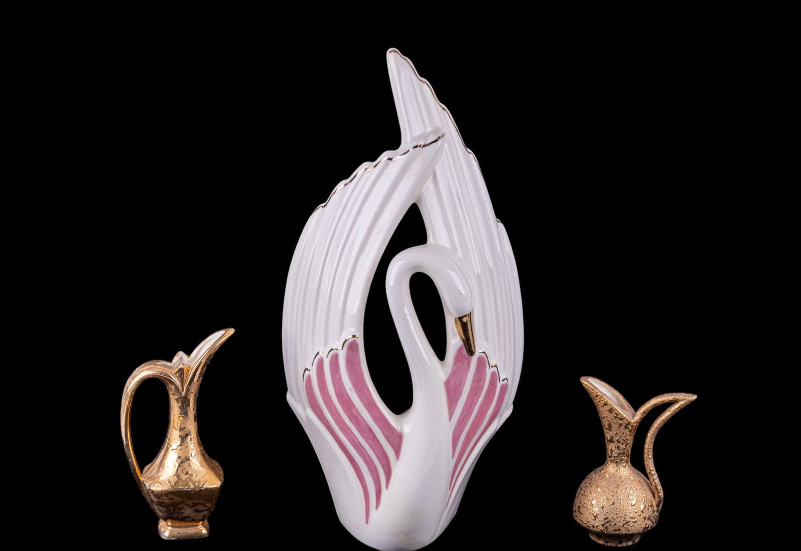 MCM Swan Statuette and Weeping Gold Vases: Two mid century modern weeping gold amphora style vases, 8" and 6", only the smaller is signed 'MB 66', and a large ceramic swan statuette with pink and gold accents, after Haeger, 9x7x19".