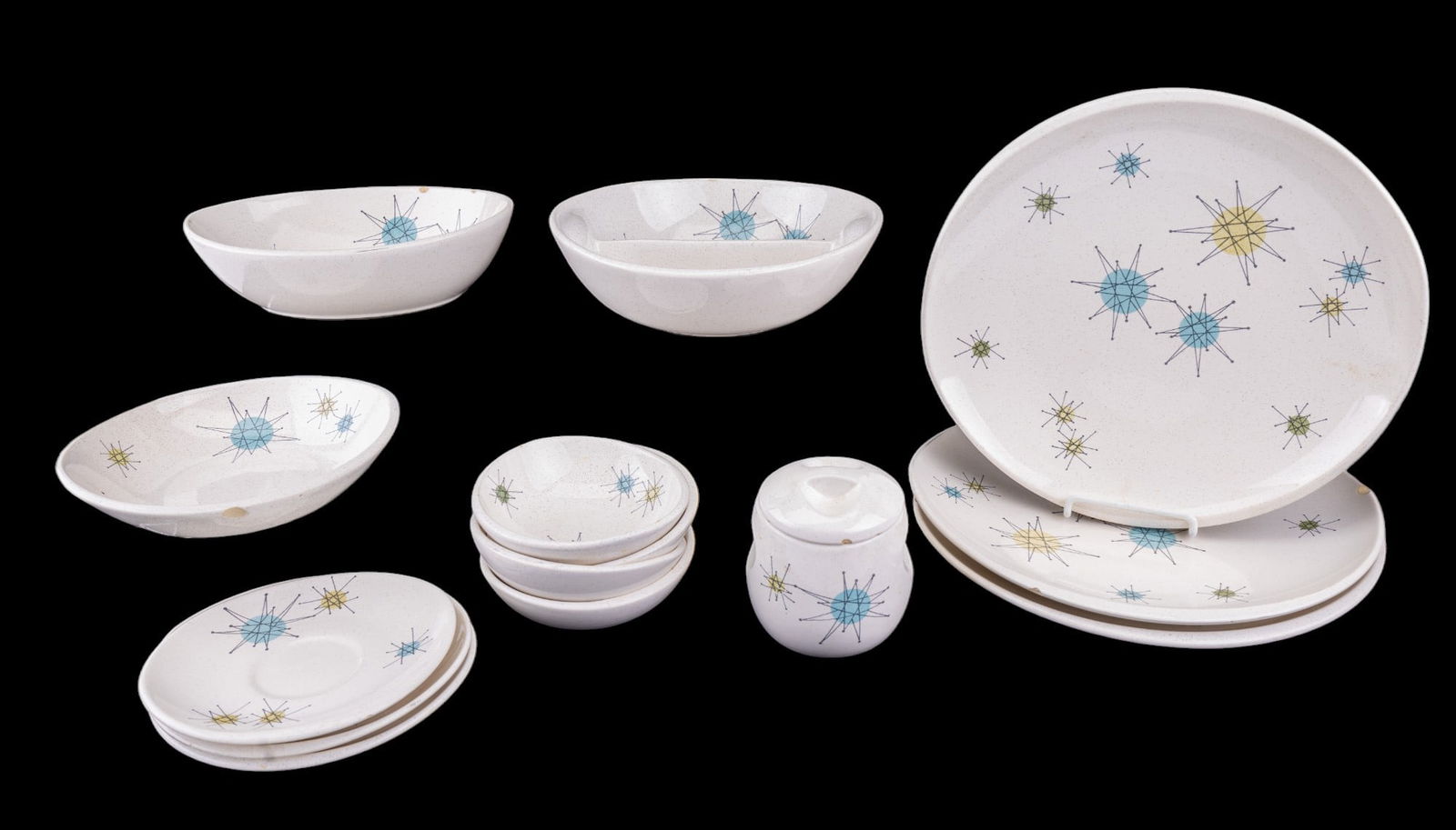 Franciscan Starburst Stoneware: An assortment of Franciscan Earthenware speckle glazed stoneware dinner service pieces with an atomic starburst mid century modern design, including 3 dinner plates, 2 bread plates, 1, saicer, 4 fruit