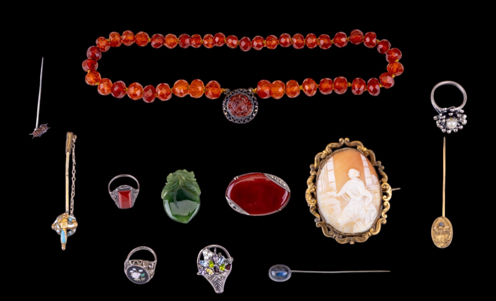 Art Deco to Victorian Estate Jewelry: Sampling includes a sterling silver carnelian and other sterling silver semi precious rings, early carved shell cameo, Stick pins, carnelian pin, and other items.