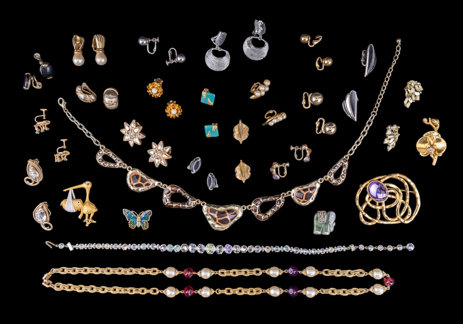 Trifari Earrings and Vintage Jewelry: Silver tone and black enamel Trifari clip on earrings, tear drop rhinestone and gold tone bead Napier clip on earrings, BSK gold tone leaf clip on earrings, green hardstone elephant pendant, giraffe p