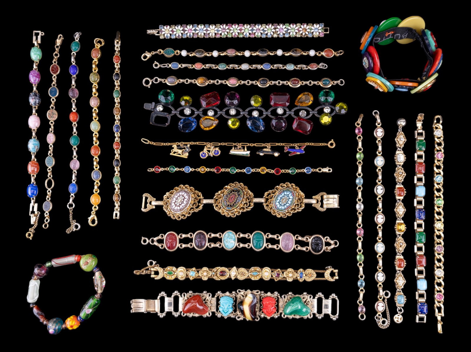 Multicolor Scarab, Rhinestone, More Bracelets (25): Collection of 25 multicolor bracelets, including 8 different etched scarab bracelets, other stone bracelets, a cameo bracelet, rhinestone bracelets, & more. Most bracelets are chain link bracelets. Ca