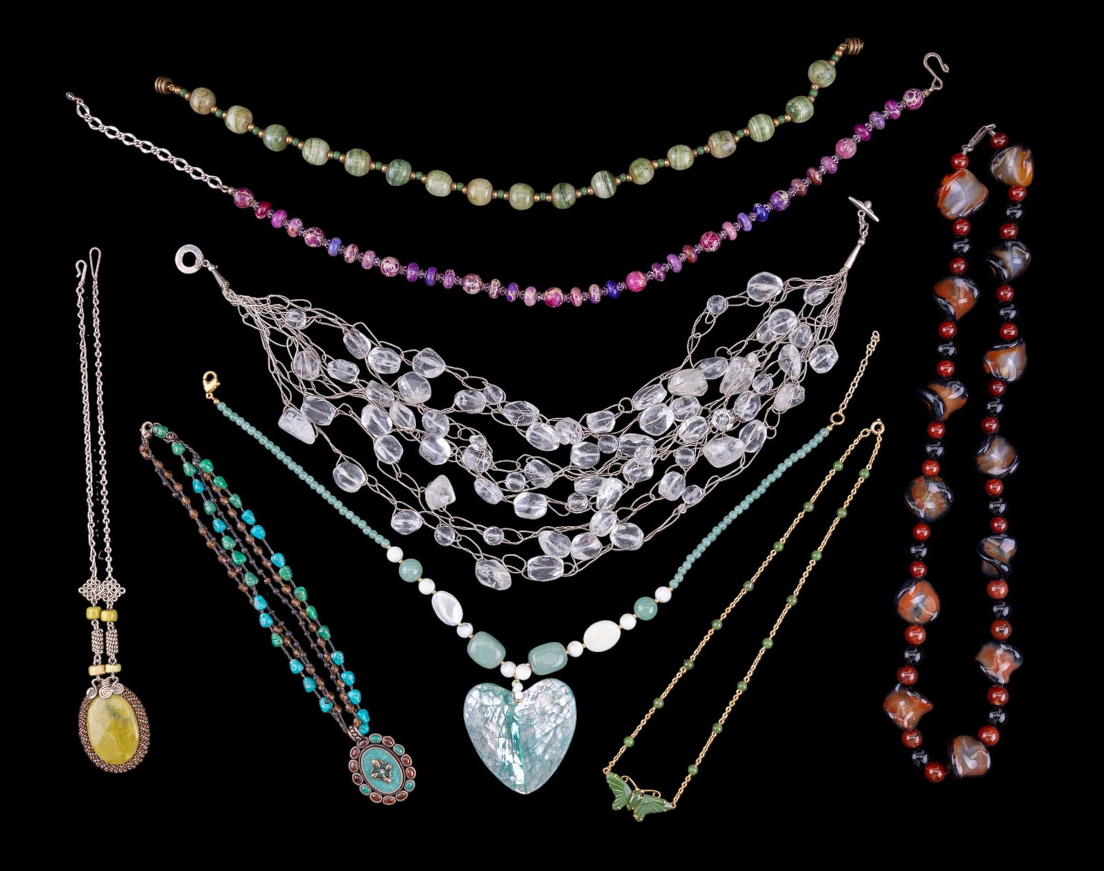Polished Stone and Glass Beaded Necklaces: A collection of glass bead and polished stone necklaces featuring rough quarts, tubled turquoise, polished purple turquoise, mother of pearl, blown glass beads, and more. Sizes range 16" to 26"
