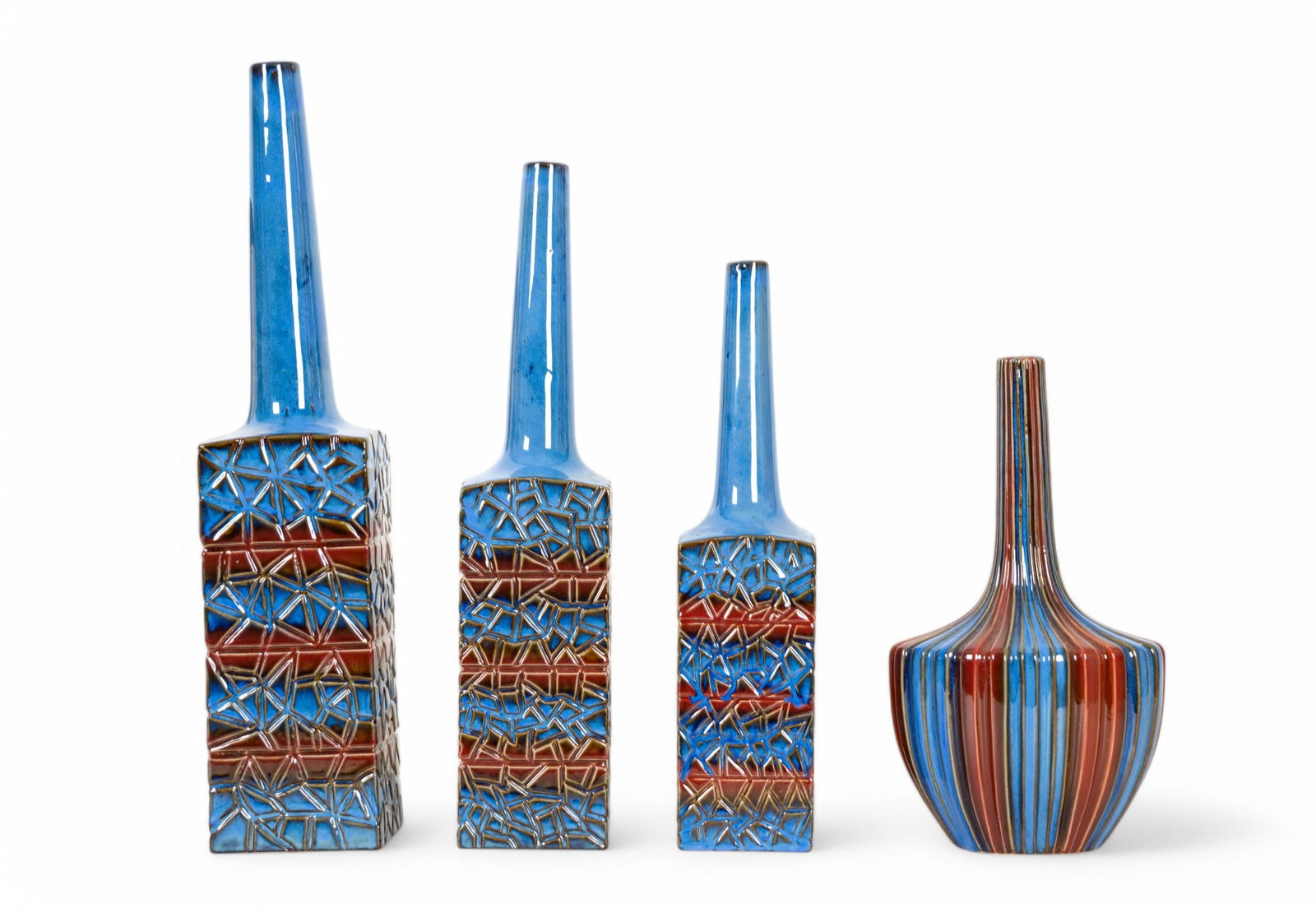 Blue & Red Porcelain Vases / Decanters (4): Collection of 4 medium blue & dark red porcelain vases. 3 have a square base w/ a geometric pattern & a narrow, cylindrical neck. The fourth vase has a rounded body w/ vertical stripes. Tallest vase m