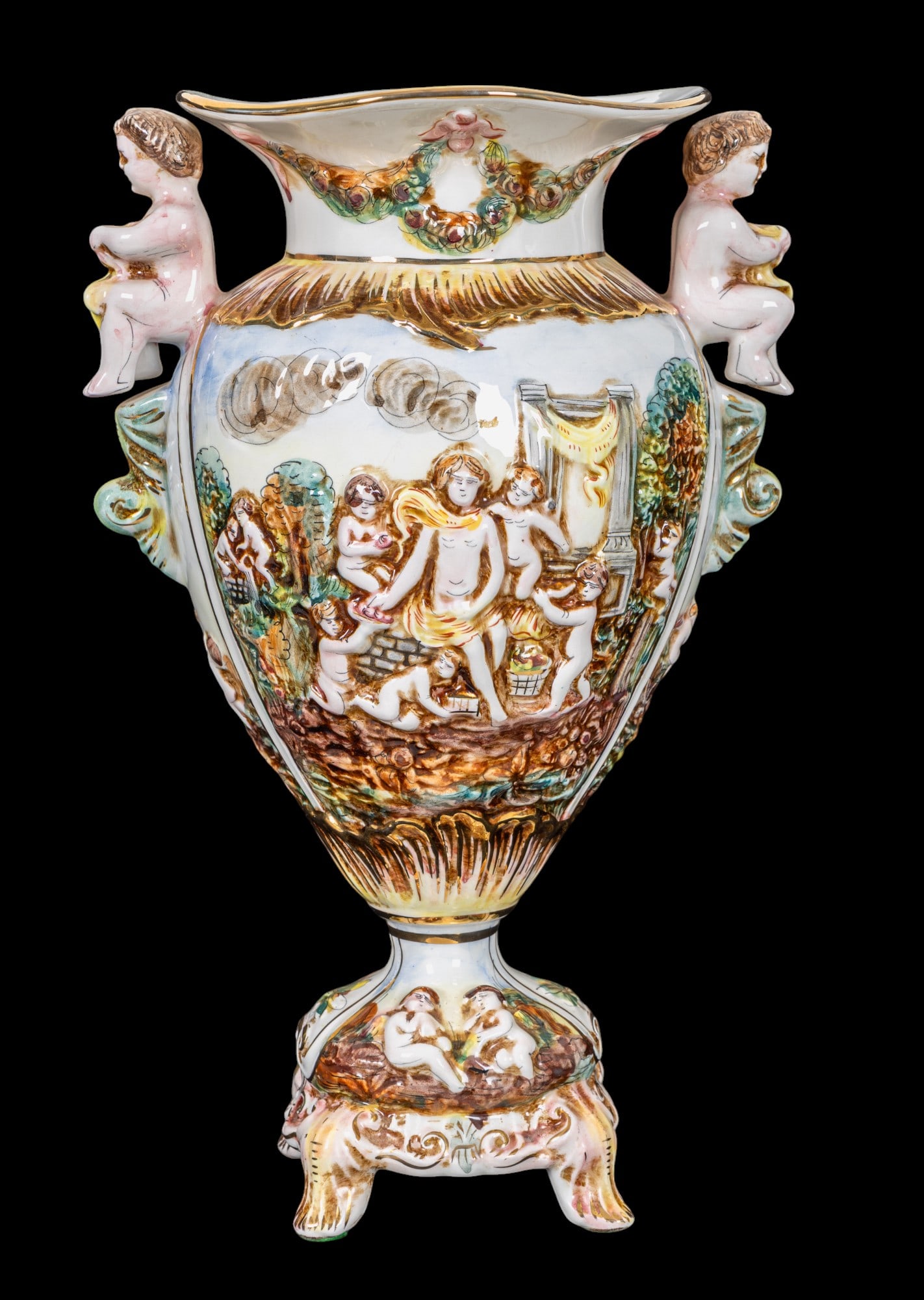 Capodimonte Italy Cherub Neoclassical Style Vase: Capodimonte Italian porcelain vase w/ relief design depicting nude cherubs & a couple in an outdoor scene. Item is marked on bottom & measures approx. 15" tall & 9.5" from handle to handle. Royal Capo