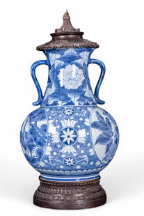 Maitland Smith Chinoiserie Jar w/ Lid & Base: Maitland Smith blue & white Chinoiserie ginger jar w/ decorated bronze lid & base. Item features intricate botanical & bird design. Vase measures approx. 21.5" tall & 11" in diameter at widest point.