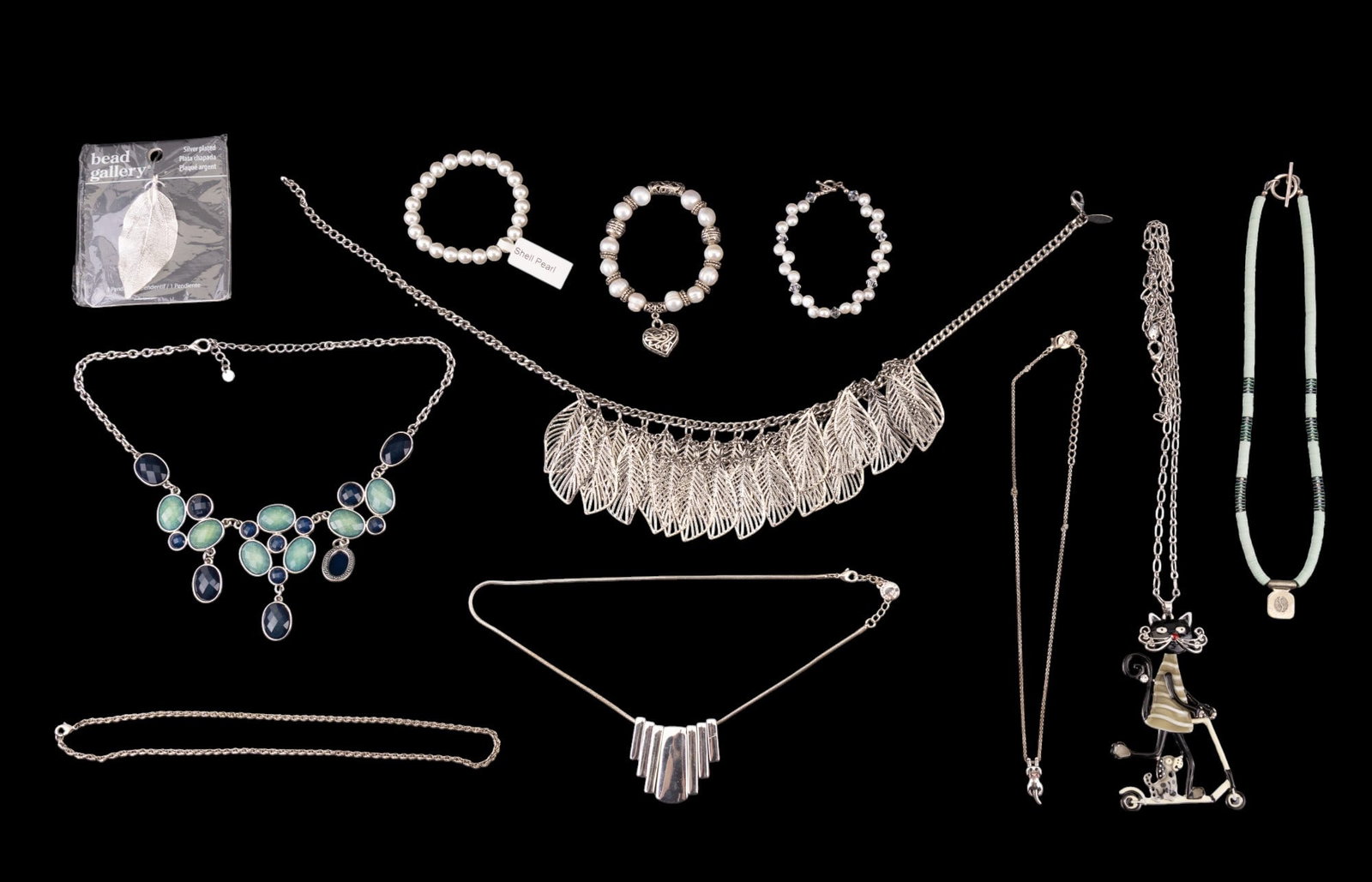 Pearl, Sterling, Liz Clairborne, Enamel, more: Grouping of silver tone, pearl, sterling & more. A Liz Clairborne silver tone necklace, three pearl bracelets, sterling silver wire and disk bead necklace, "NY" marked leaf silver tone statement neckl