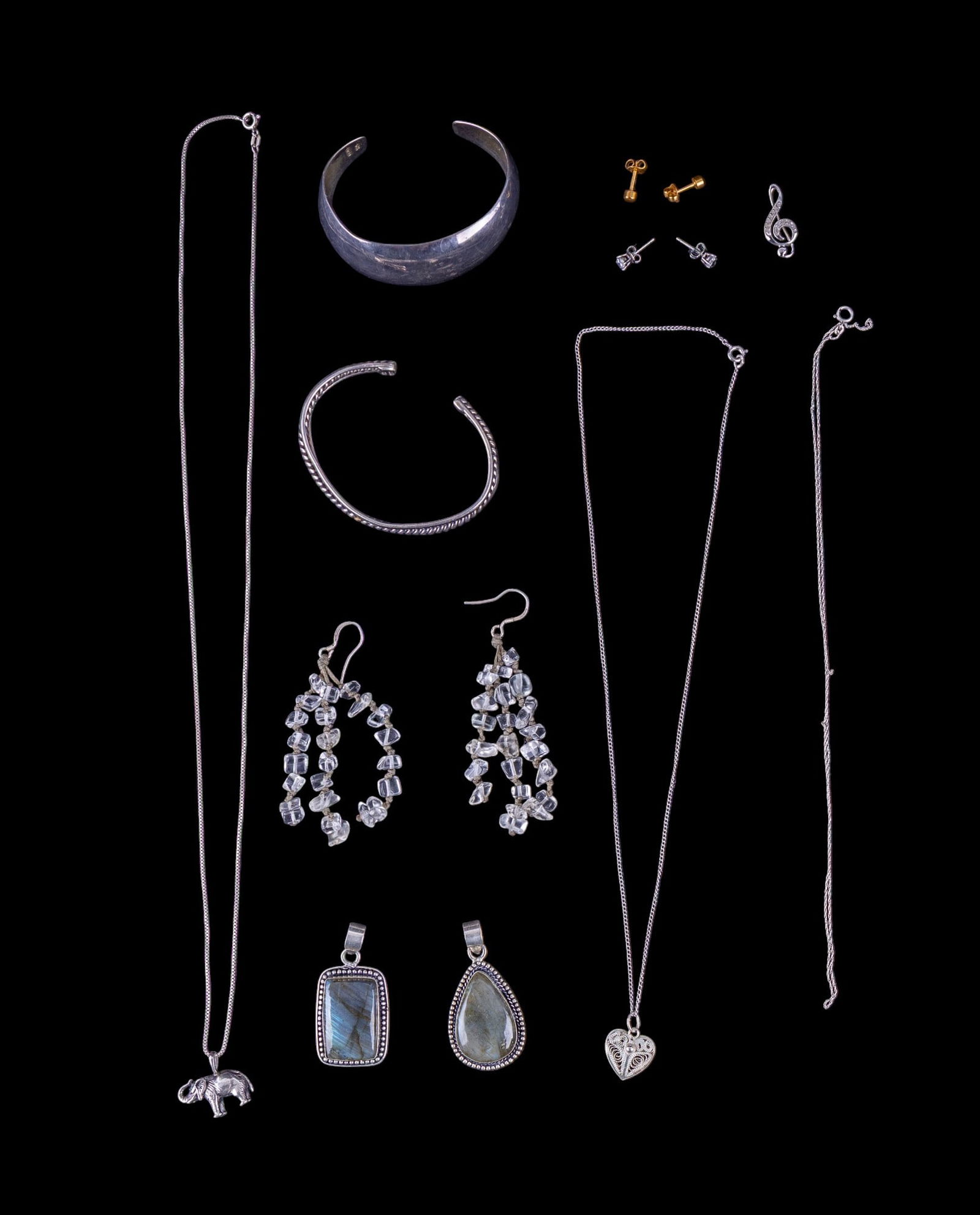 Sterling Silver Necklaces, Bracelets, & Earrings: Collection of sterling silver jewelry including 2 pendants w/ labradorite cabochons (one teardrop, one rectangular), an elephant pendant necklace approx. 24" long, a filigree heart pendant necklace, a