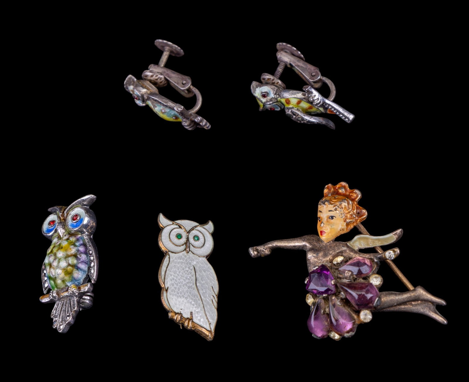 Sterling Estate Jewelry: Five pieces of sterling silver jewelry including an Alice Caviness owl pin, earrings, Denmark sterling owl pin, and a sterling and enamel angel pin.