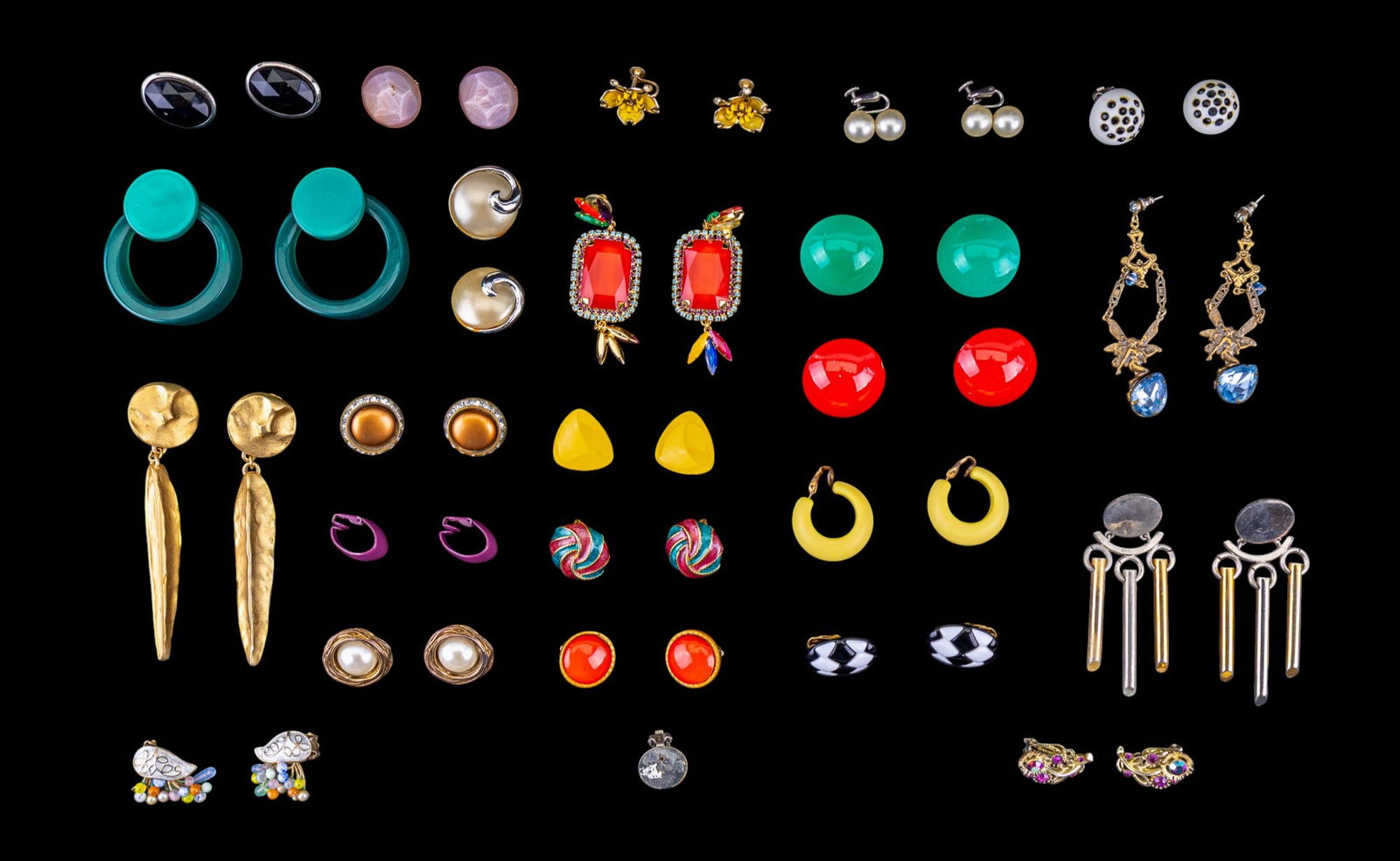 Vintage Earrings: A collection of vintage earrings including designer brands such as Lisner, Kramer, Ericson Beaman, Sadie Green fairy, and various styles featuring lucite, gold tone, and more.