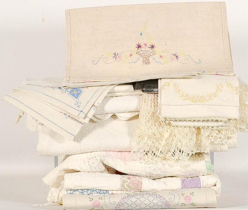 Large Grouping of Early Fabric & Linens: Large grouping of early fabric and linens including two embroidered table runners, each measuring 17" x 34", crochet work, bedspreads, handmade bolster down pillow, a 19th C table runner with floral e
