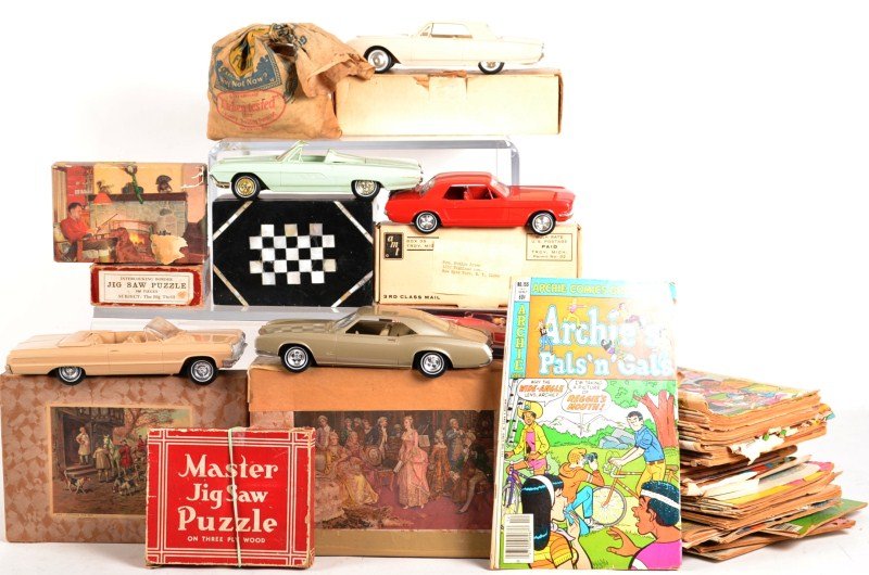Large Grouping of Models, Puzzles and Games: including three Thunderbird models, an AMT Mustang (all four cars manufactured by "Welder") five puzzles including one manufactured by K Straus, and a collection of early comic books