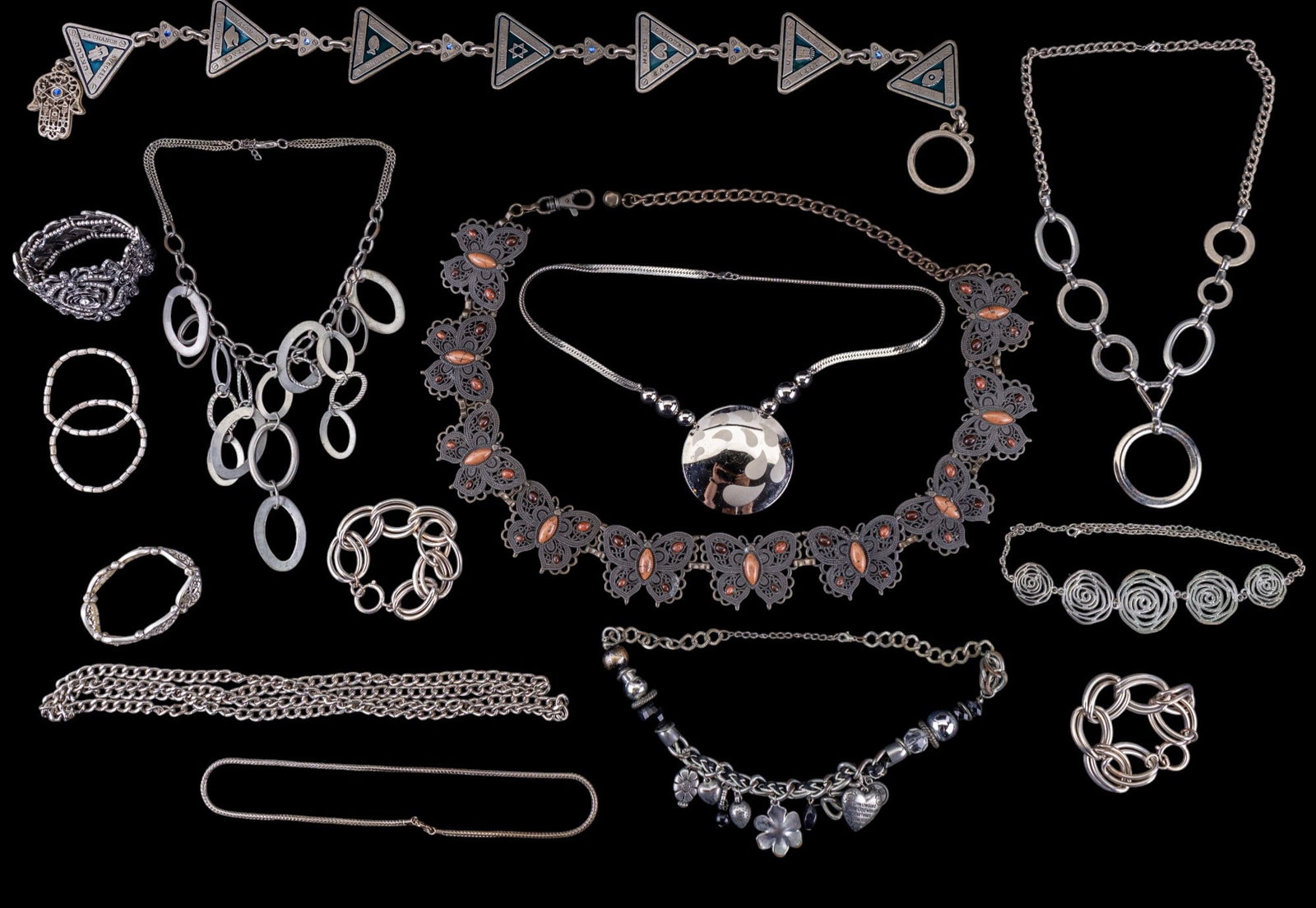 Industrial Style Silver Tone Jewelry: A collection of industrial style and vintage silver tone necklaces and bracelets, also including a metal and enamel panel belt with Hebrew figures ~26" L, a vintage style metal panel butterfly belt wi