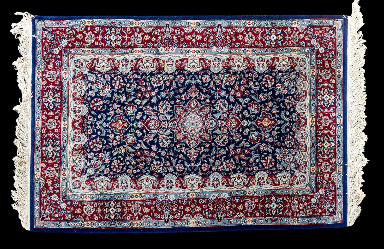 Chinese Wool Rug: Chinese wool rug approx. 6' x 4' w/ deep red, blue, livid blue-grey, sage green, dull pink, brown, tan, & ivory patterns w/ floral motifs. See photos for further details. *All rugs / carpets are used