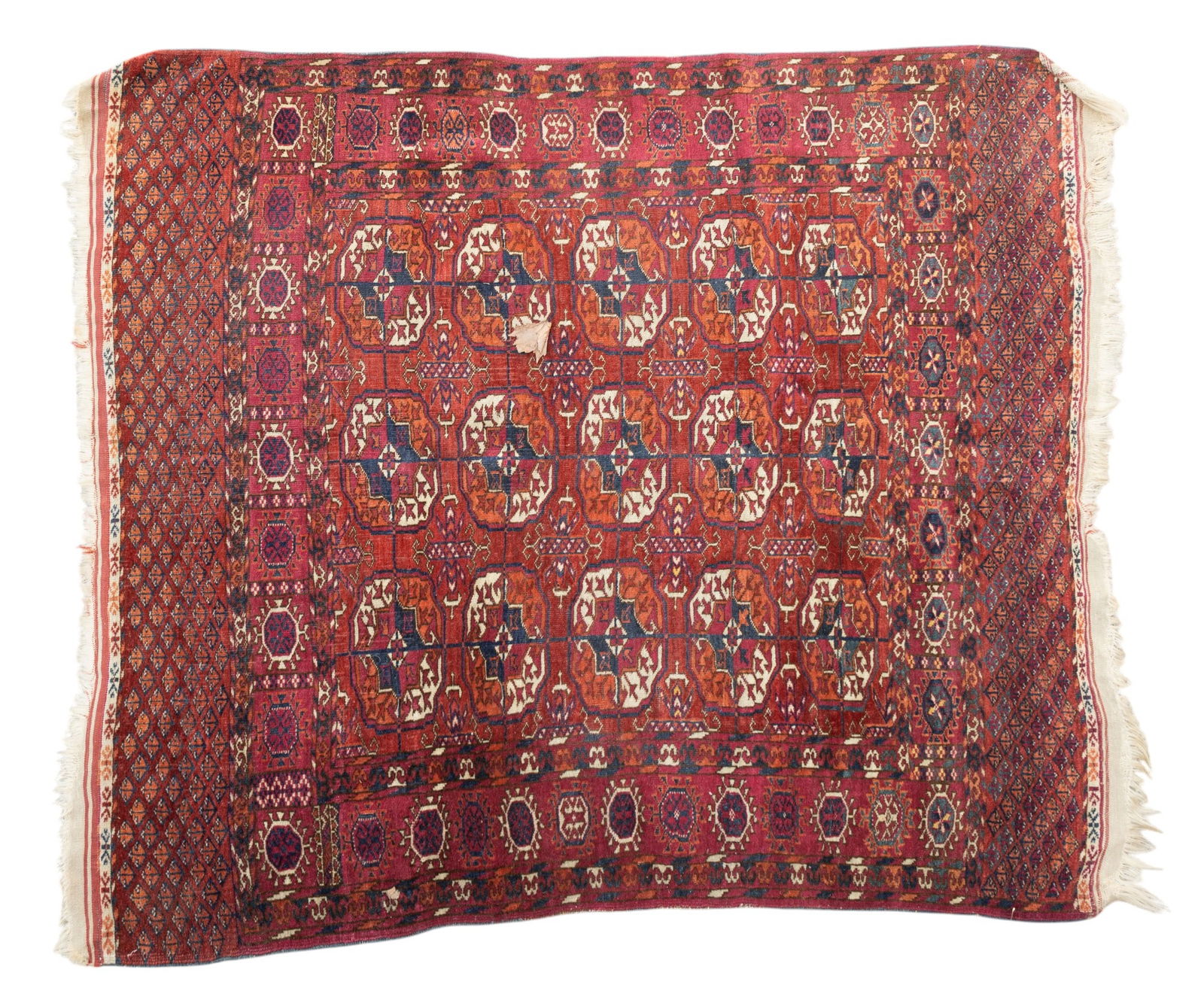 Early 20th C. Persian Tekke Rug: Early 20th century Persian Tekke rug approx. 4'4" x 3'10" w/ red, dark blue, livid blue-grey, green, brown, tan, & ivory patterns w/ floral motifs. Some restoration. See photos for further details. *A