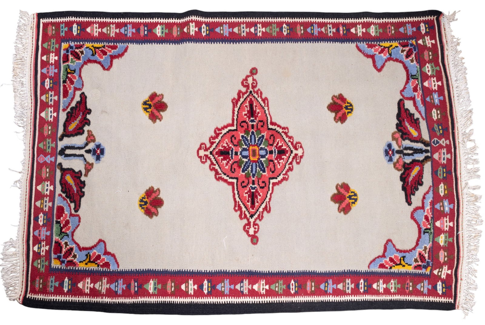 Portuguese Floral Rug: Portuguese rug approx. 4'11" x 3'5" w/ red, dark blue, livid blue-grey, green, pink, yellow, brown, tan, & ivory patterns w/ floral motifs. See photos for further details. *All rugs / carpets are used