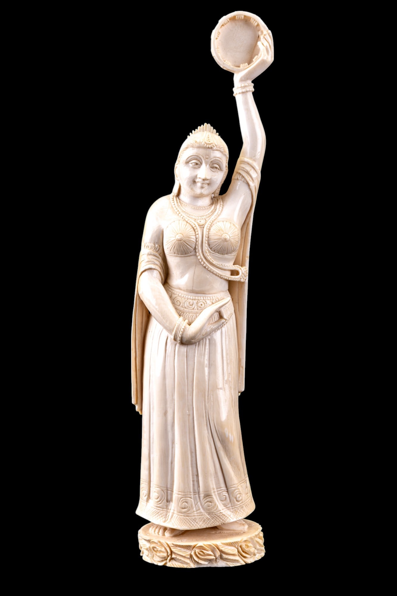 Indian Carved Bone Female Dancer Figurine: Highly-detailed Indian carved bone / natural material figurine of a female dancer w/ a tambourine in her left hand. Figurine measures approx. 11.5" tall & 2.25" x 2.75" at the base. Item must be sold