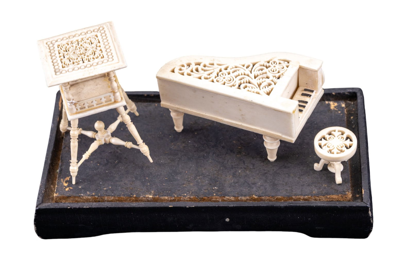 European Carved Bone Piano w/ Stool + Table: European intricately-carved bone / natural material miniature dollhouse-scale piano & stool w/ decorative patterns on the top & 4-legged table that features a decorative pattern on the top, an openwor