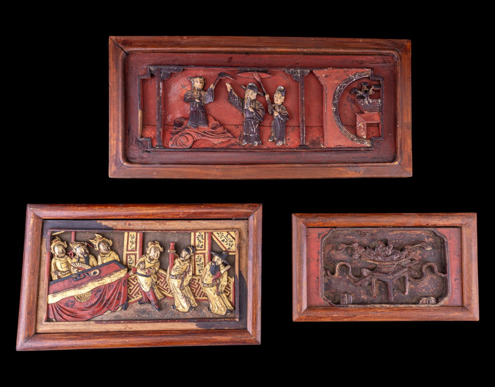 Three Figural Carved Asian Panels: Three Vintage Figural Carved Asian Panels, the largest measuring approx. 7.5 x 16 inches. Designs feature people in garden scenes. See photos for further details.
