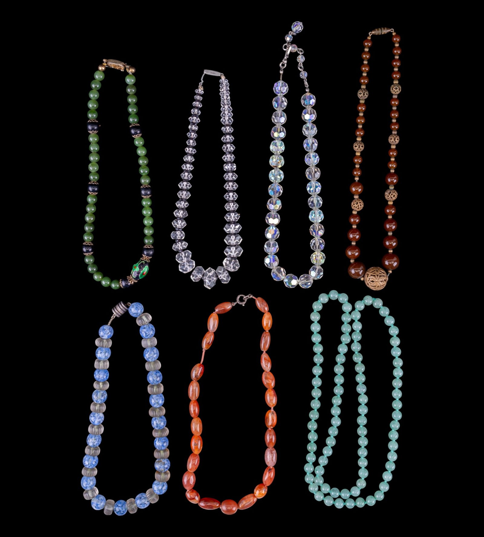 Vintage Art Deco Jade Necklaces: Seven necklaces including some clasps marked silver; two Chinese jade-style; glass, crystal rhinestone, and more.